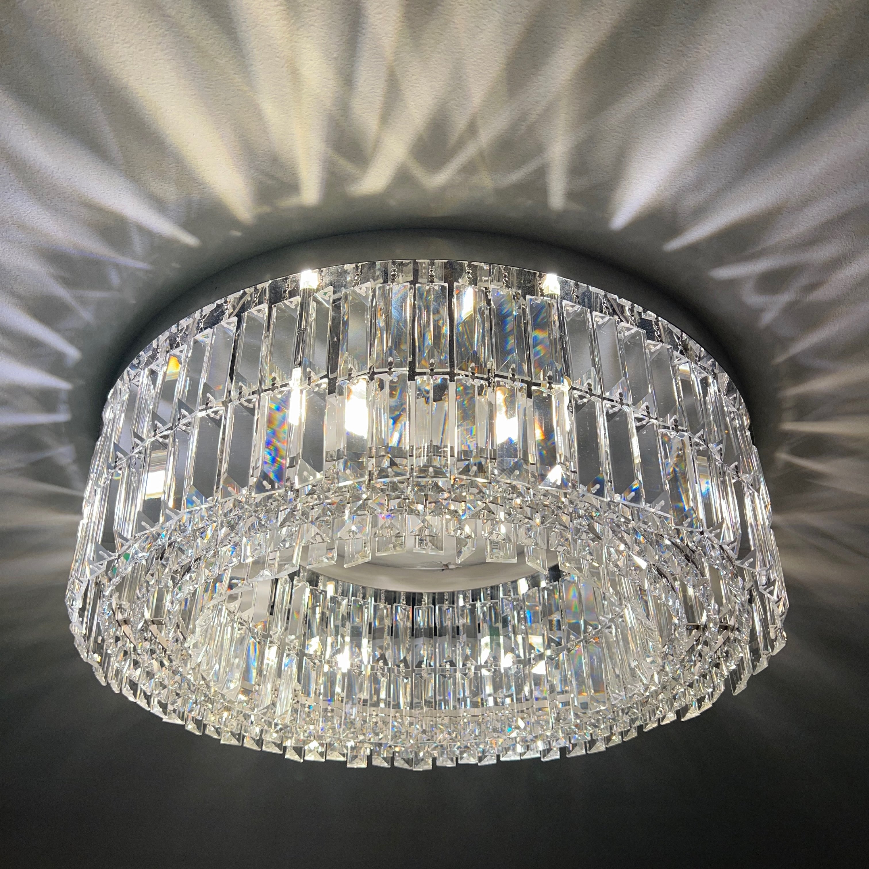 Modern crystal ceiling light adding elegance and warmth to a refined residential interior