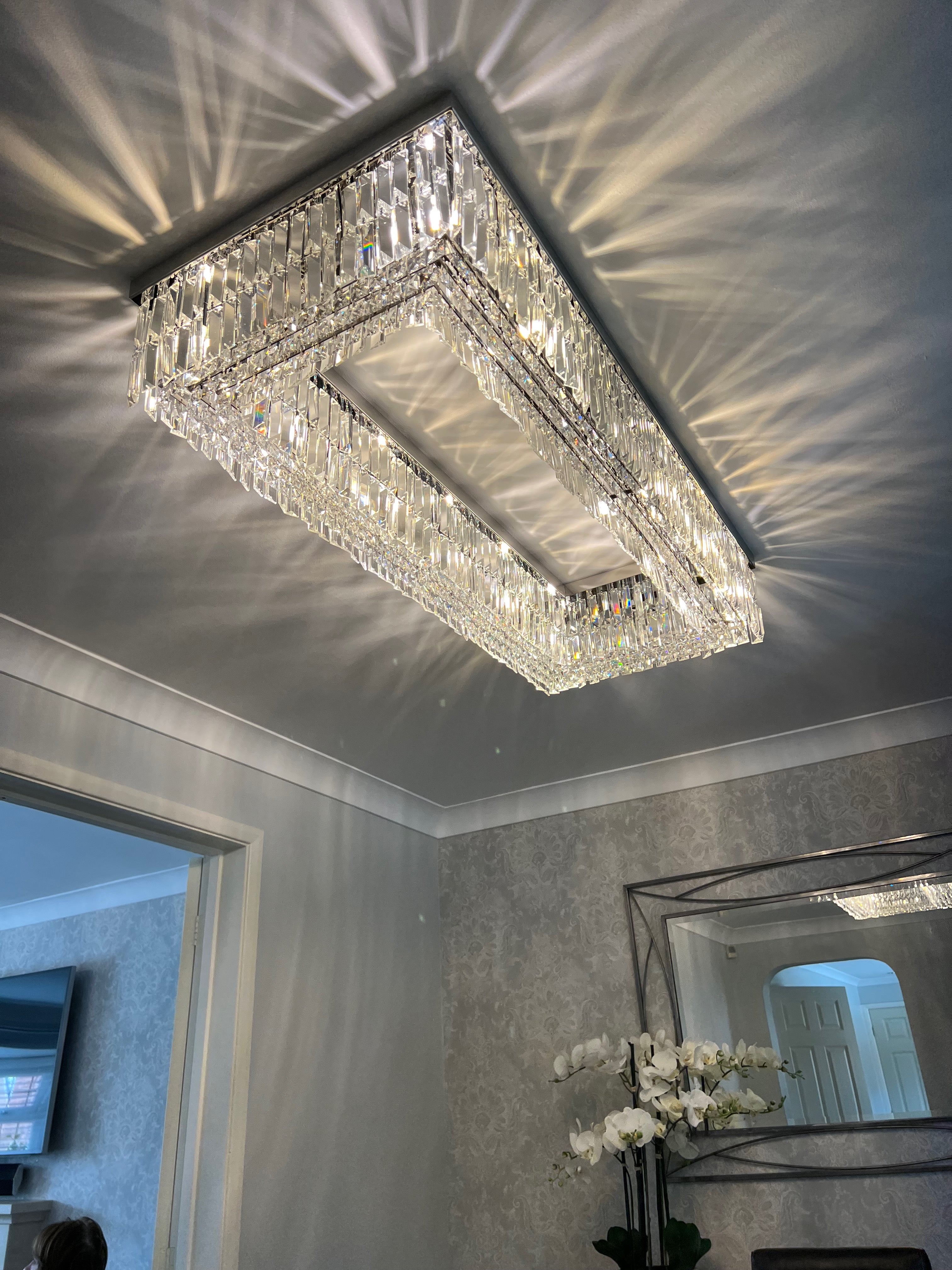 Luxury ceiling light creating a soft ambient glow and decorative light reflections