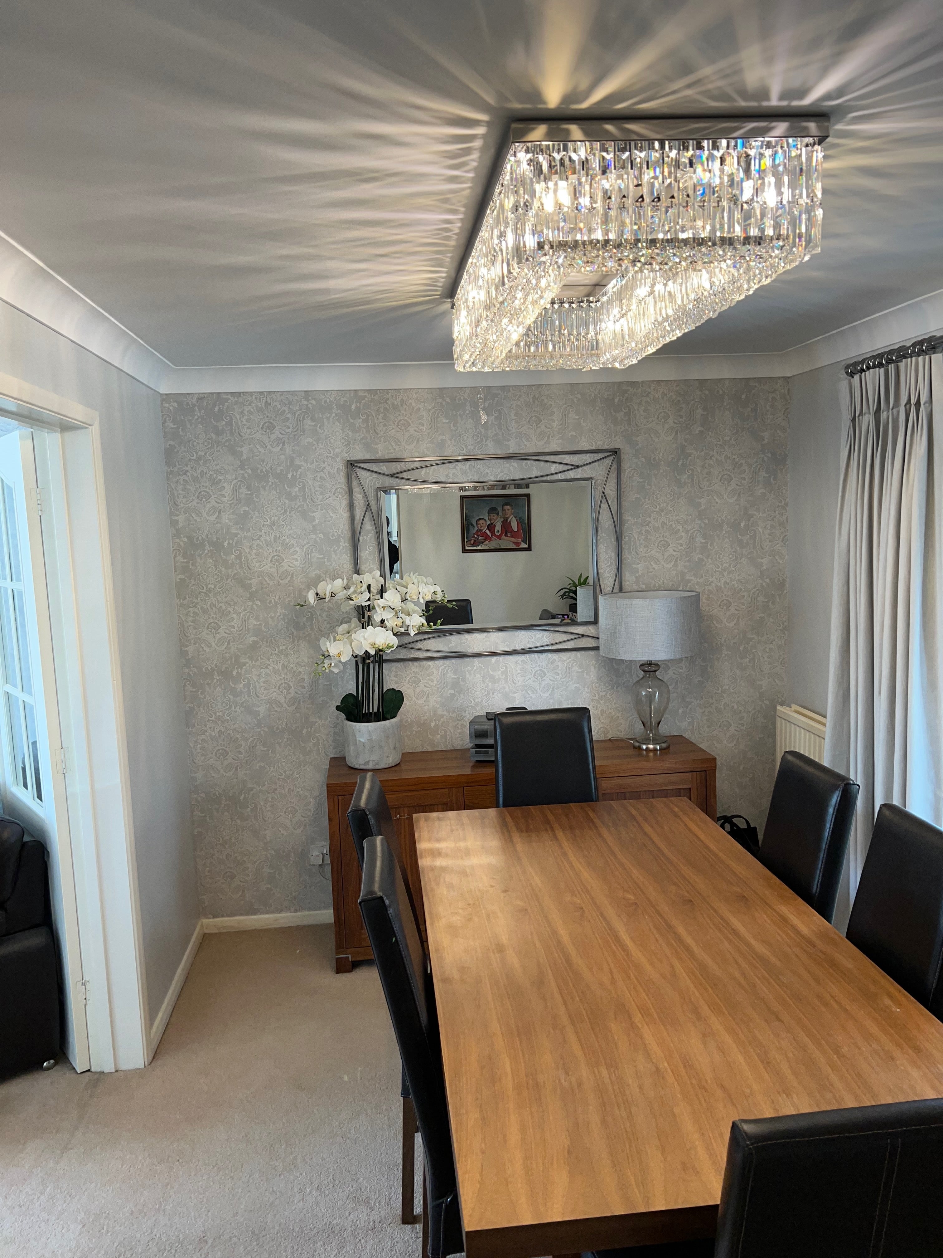 Rectangular crystal ceiling light installed in a refined modern interior setting