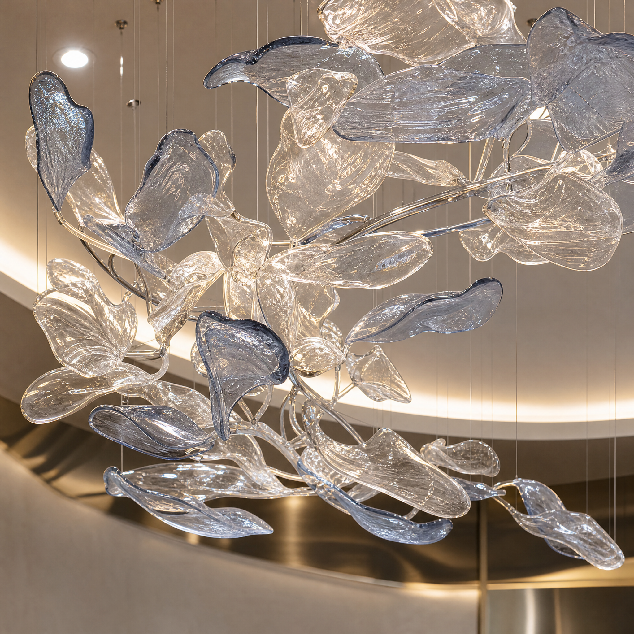 Detailed closeup of the VORELLI Crystal Current lighting fixture, showcasing the intricate texture of handcrafted flowing glass elements.