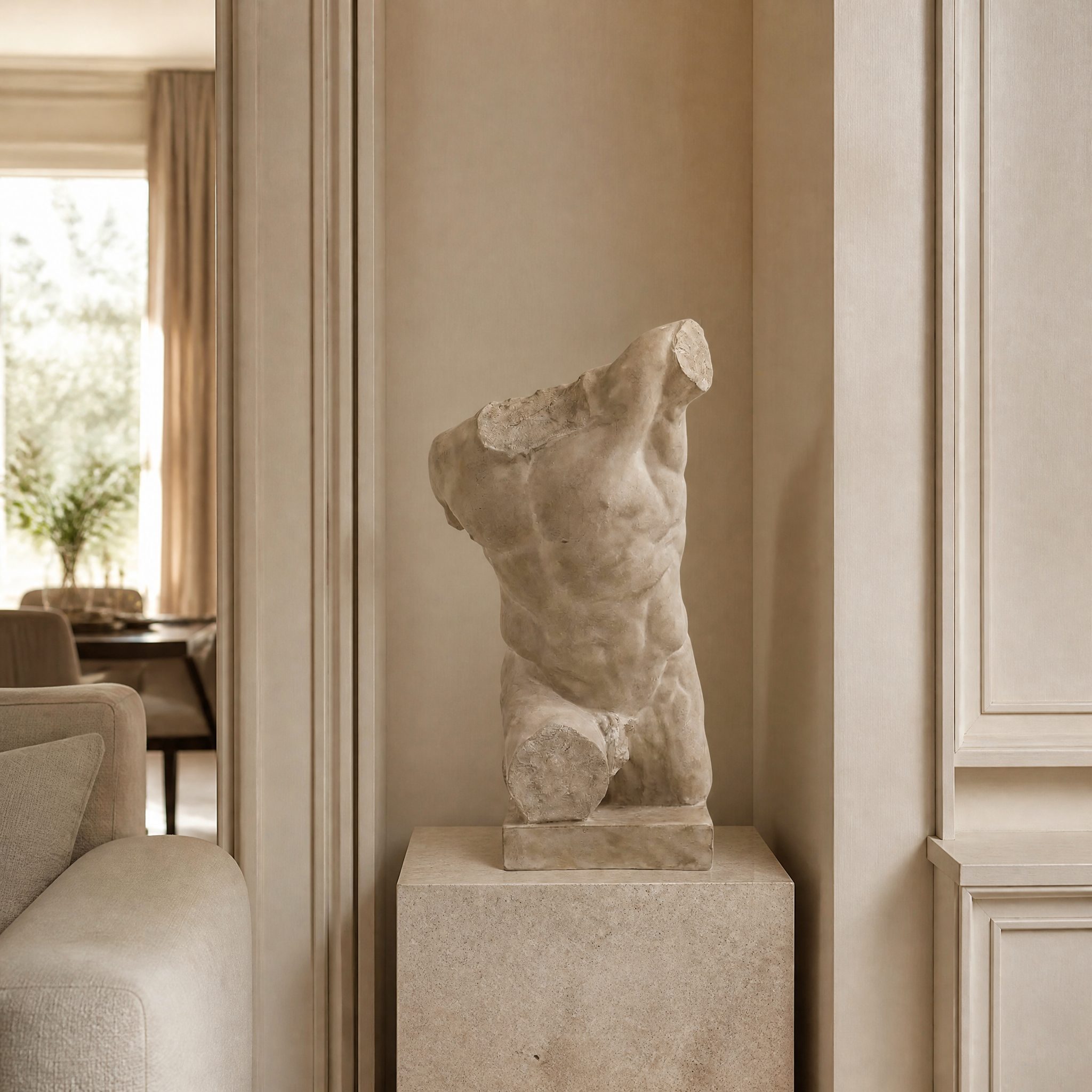 VORELLI Dalmazio male torso sculpture decor with an aged plaster finish displayed on a modern console table in a luxury residential living room setting.