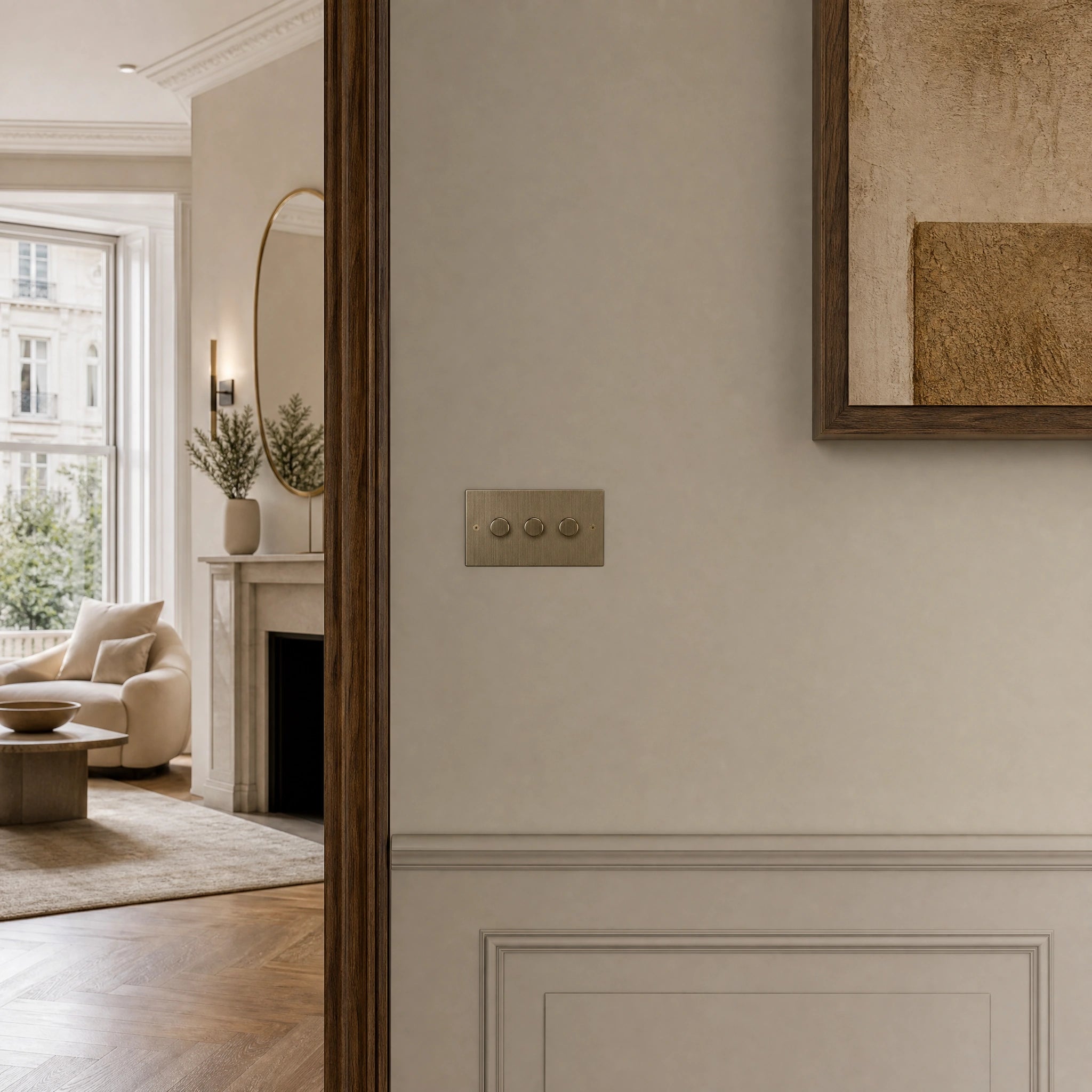 Luxury antique brass dimmer switch installed within feature wall beside an elegant doorway in a Belgravia-style residence in a UHNW interior by VORELLI®.