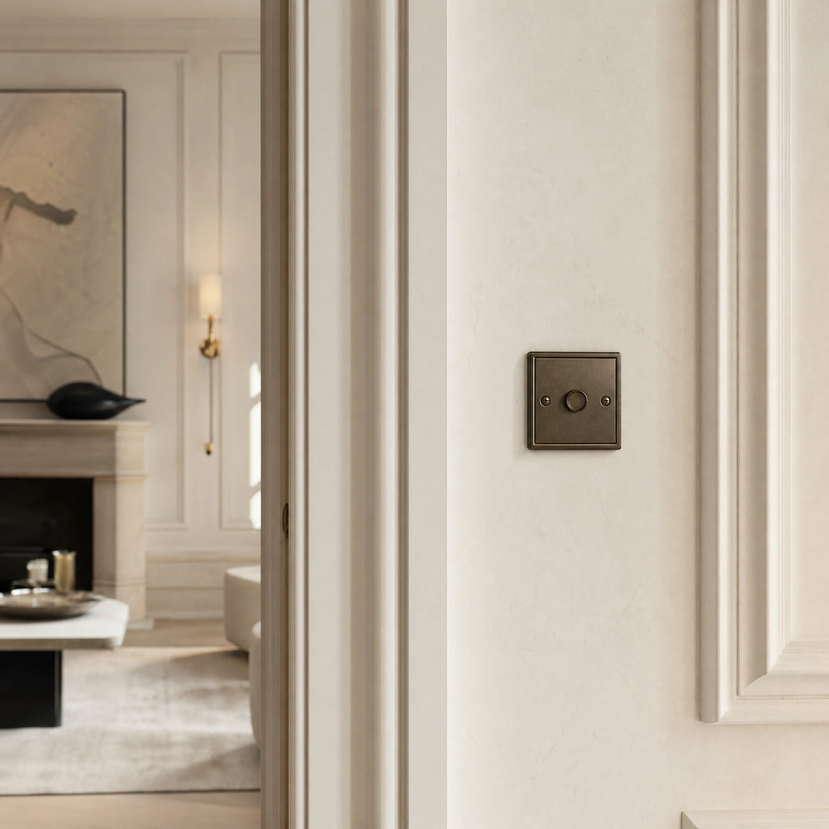 Luxury antique bronze dimmer switch installed within feature wall beside an elegant doorway in a Belgravia-style residence in a UHNW interior by VORELLI®.