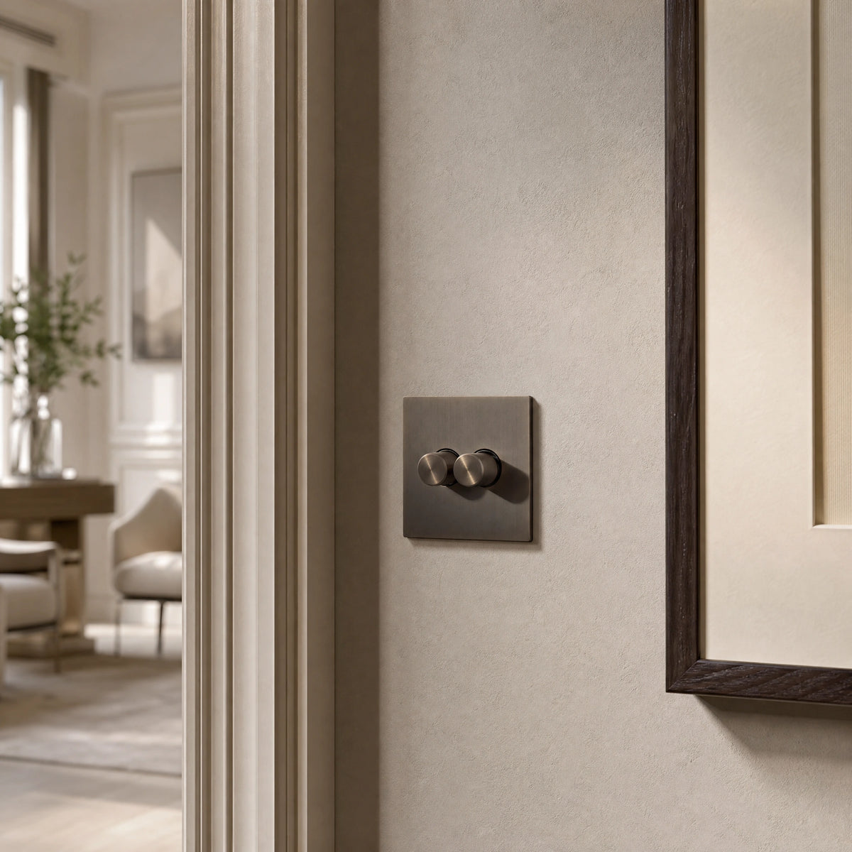 Close-up of a luxury umber dimmer switch installed within feature wall beside an elegant doorway in a Belgravia-style residence by VORELLI®.