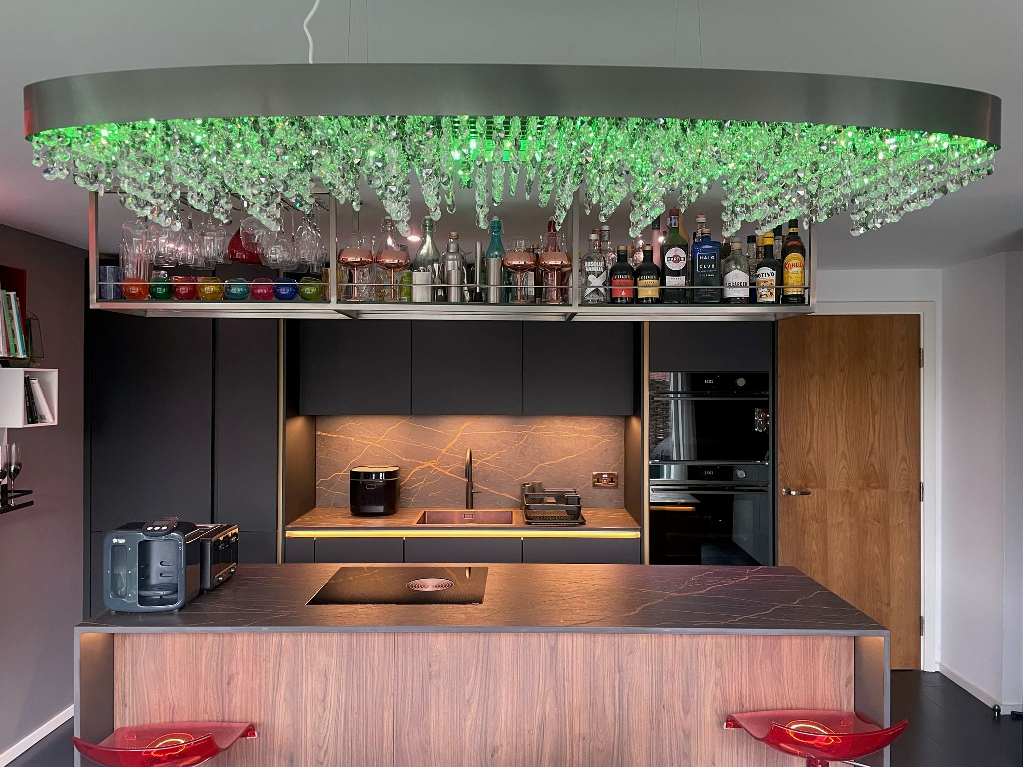 Modern VORELLI® Donatello rectangular chandelier installed above a designer kitchen ceiling feature