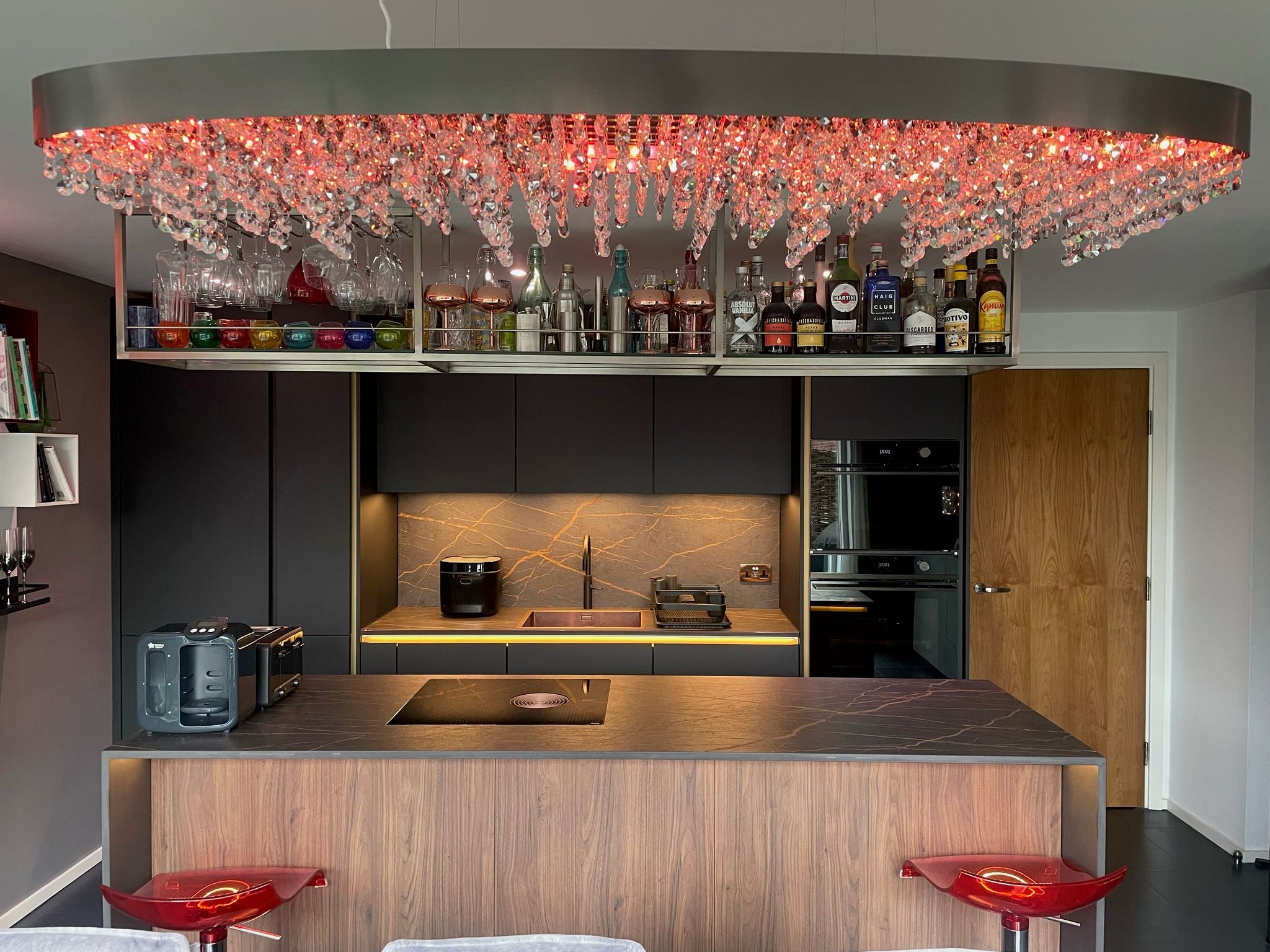 VORELLI® Donatello rectangular chandelier with pink RGB crystal lighting in a contemporary interior