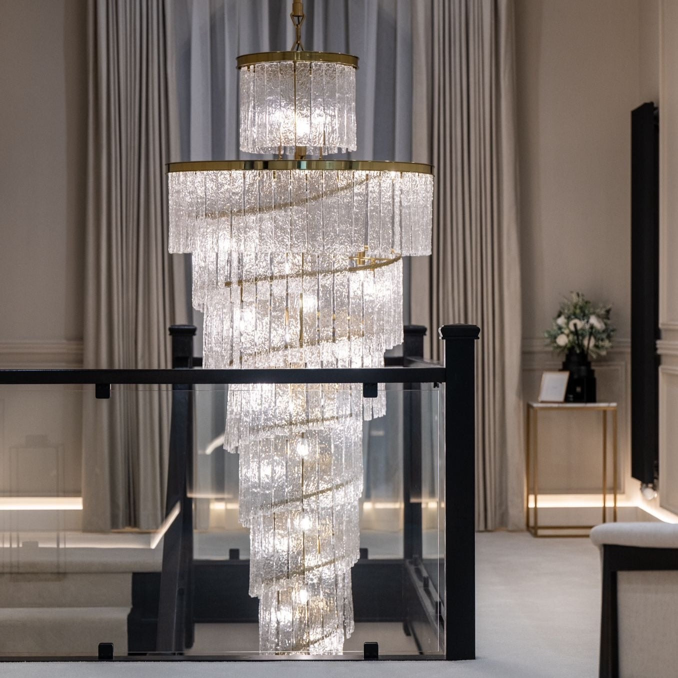 Multi tier spiral crystal chandelier designed for luxury staircase lighting