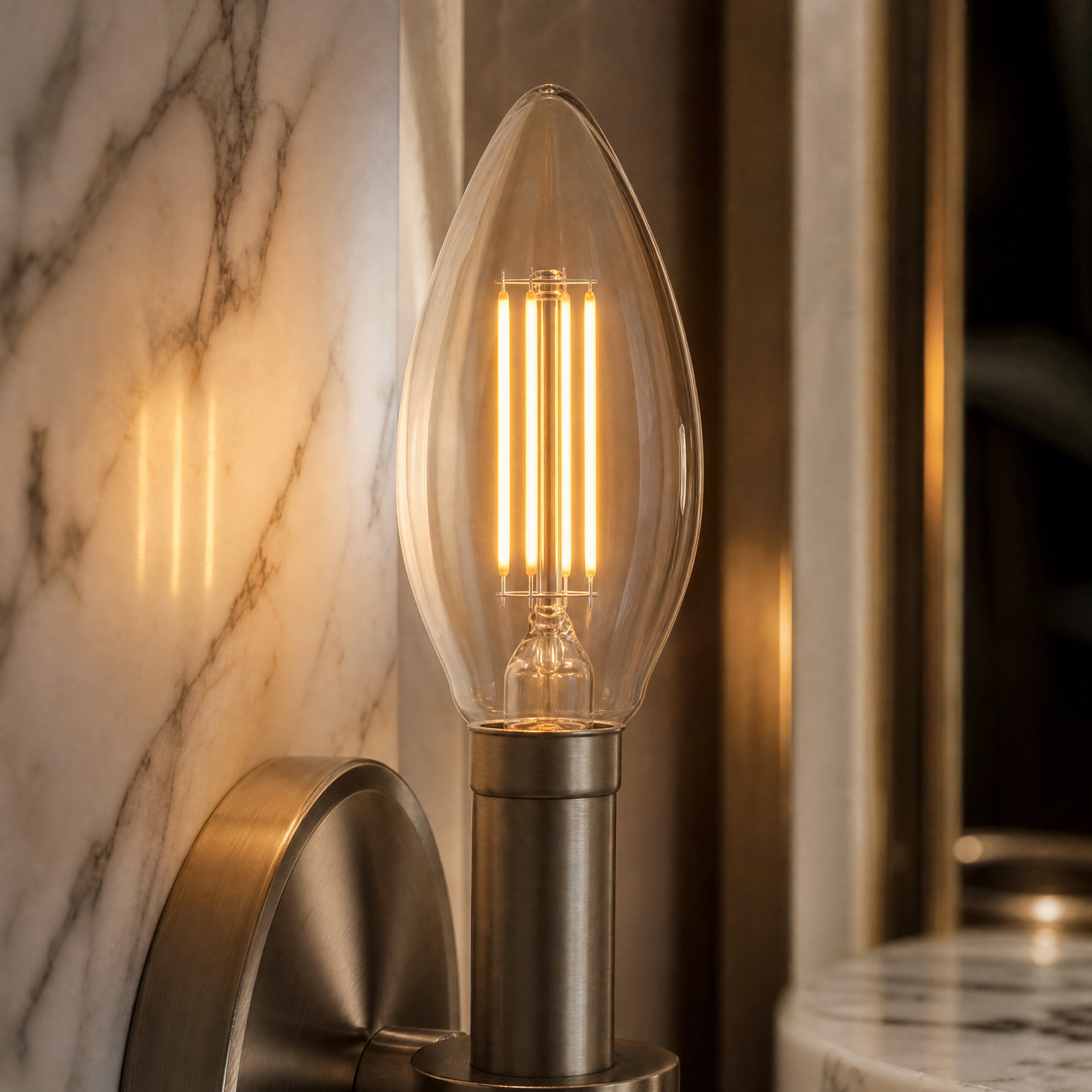 A detailed closeup of the VORELLI 5W E14 LED candle bulb showing the meticulous series filament arrangement and clear glass finish.