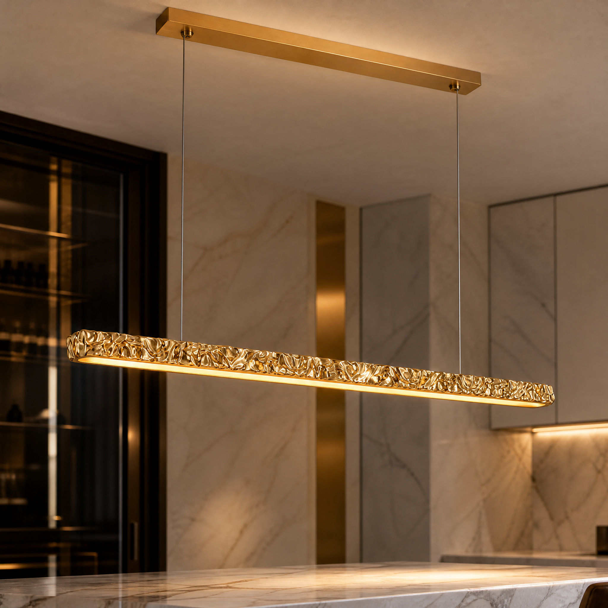 Macro closeup of the VORELLI Ecliptica rectangular chandelier highlighting the intricate, textured gold surface and premium finish.