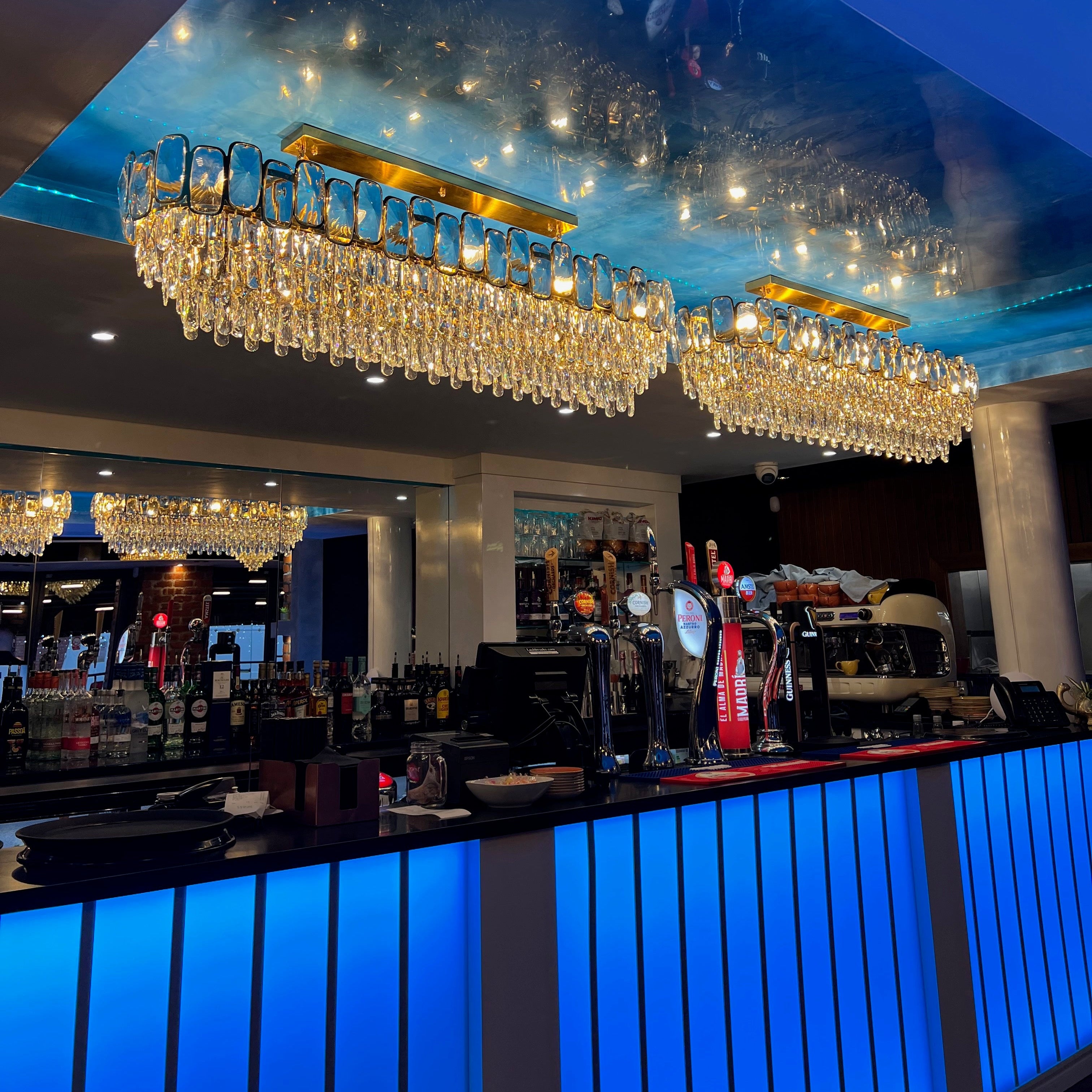VORELLI Edmond rectangular crystal chandelier installed in luxury hospitality interior