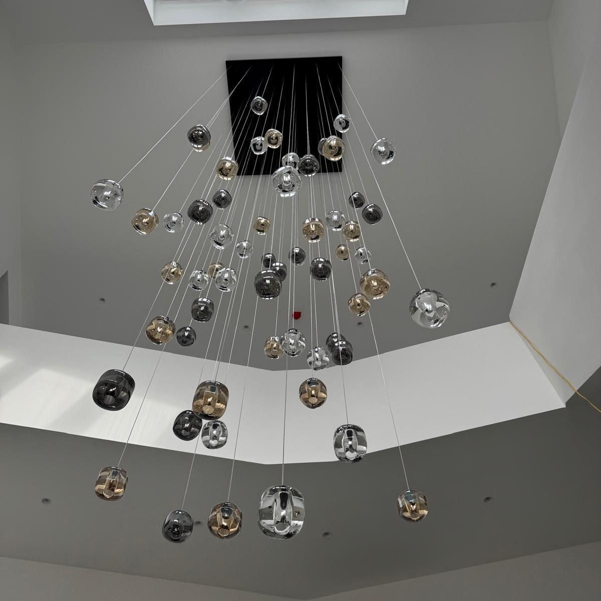 Luxury glass cluster pendant staircase chandelier in modern double height stairwell by VORELLI®