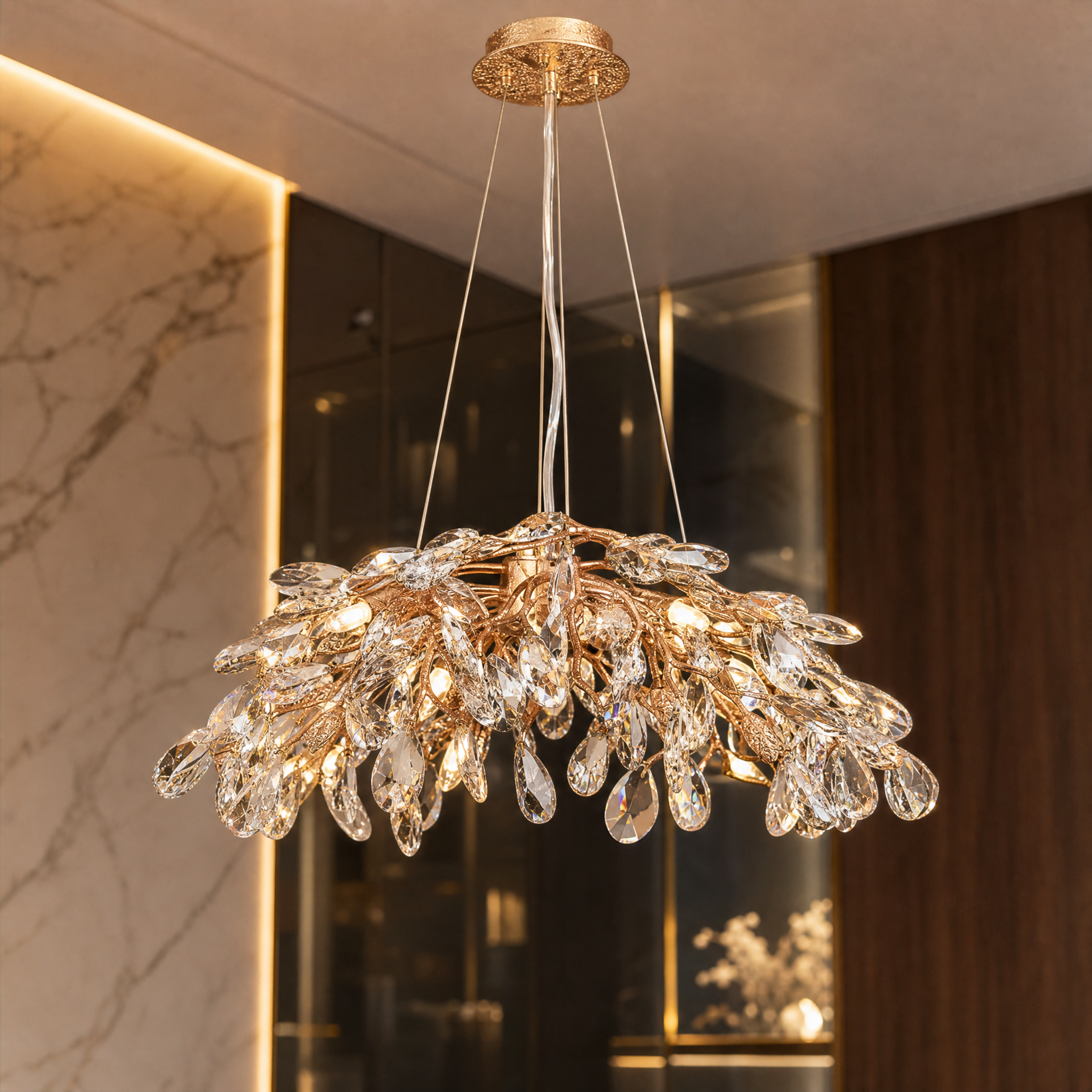 A detailed closeup of the VORELLI Entwine circular chandelier highlighting the intricate flowing branches and finely crafted suspended crystal drops creating a sparkling depth.