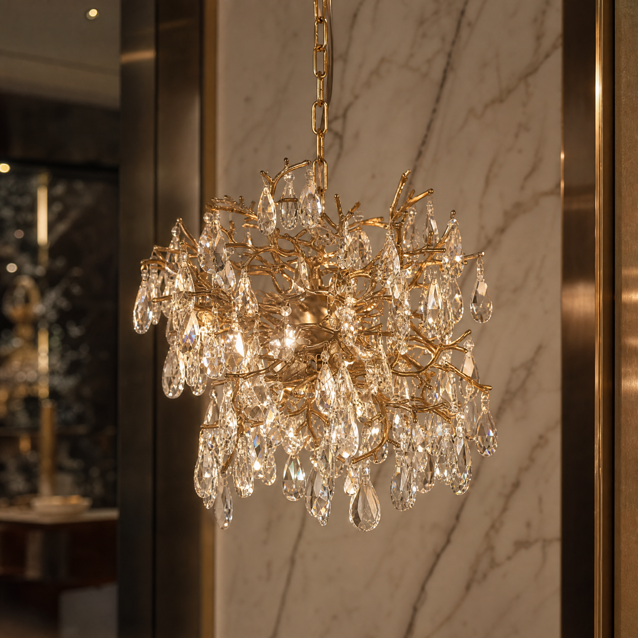 Macro view of the VORELLI Entwine Dewdrop Pendant Light, showcasing the detailed metal work and cascading crystal drops catching the light.