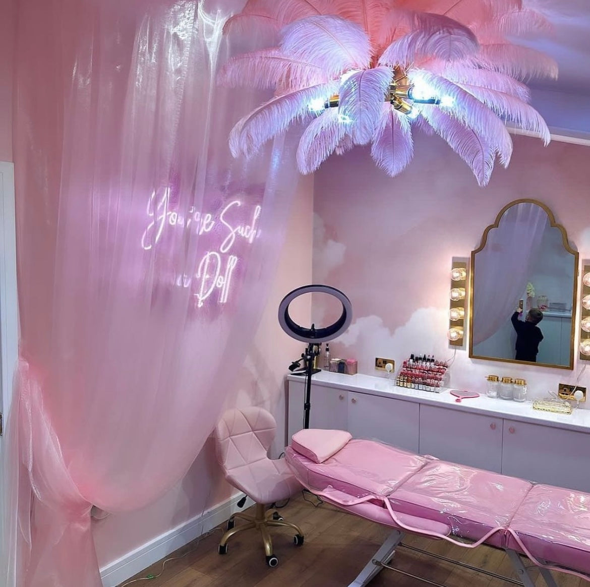 Statement feather pendant light in contemporary pink interior