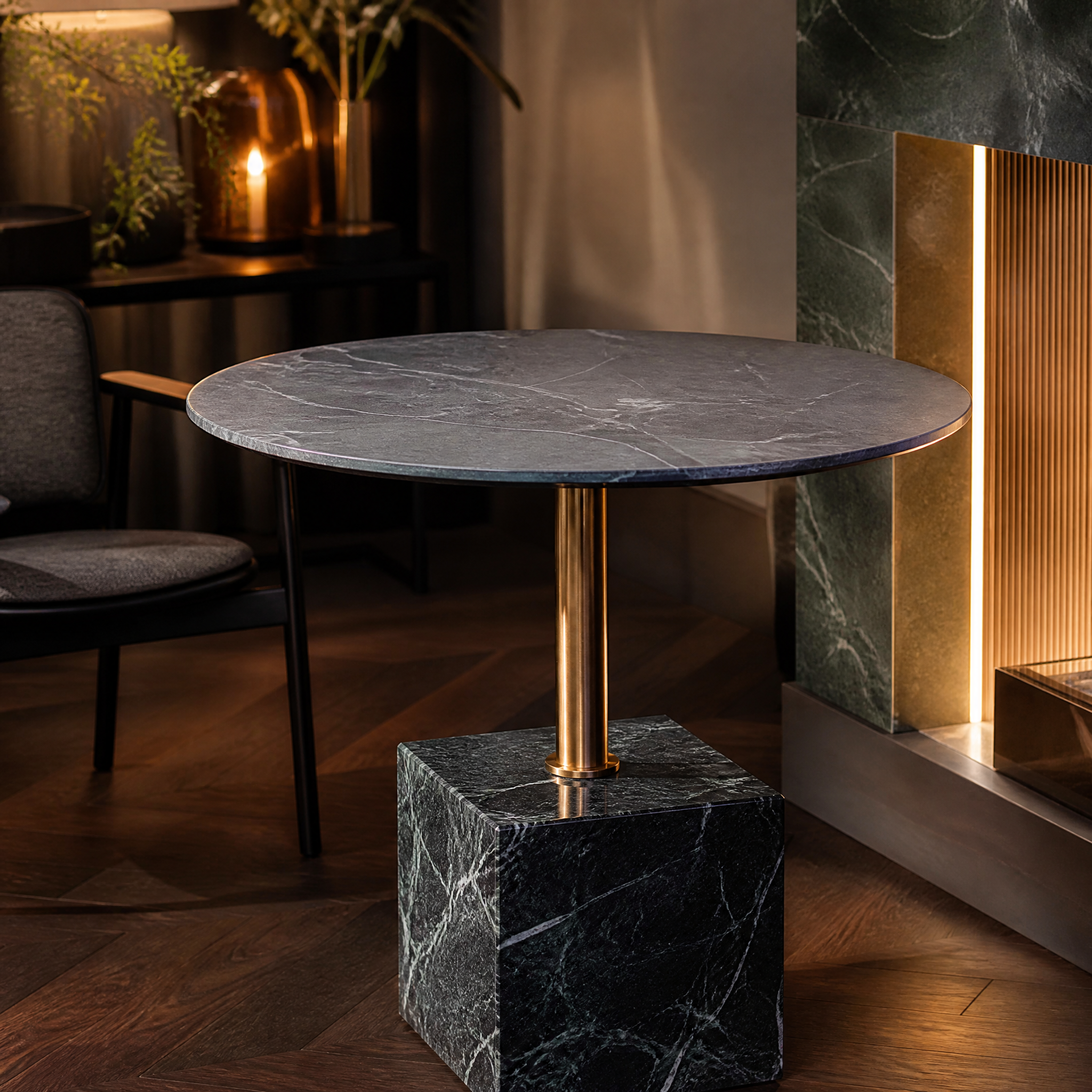 Macro close-up shot showcasing the premium veining of the round marble top and the brushed finish of the brass support column on the Fenicino table.