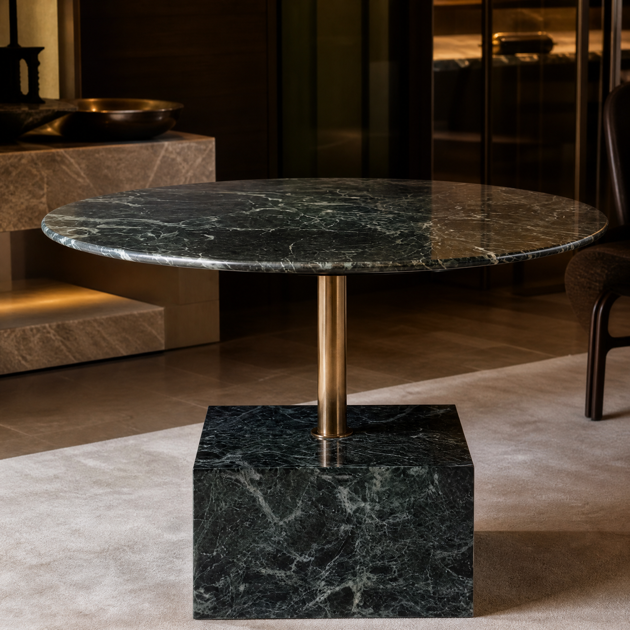Macro closeup showing the premium texture of the round marble top meeting the brushed brass support stem of the VORELLI Fenicino table.