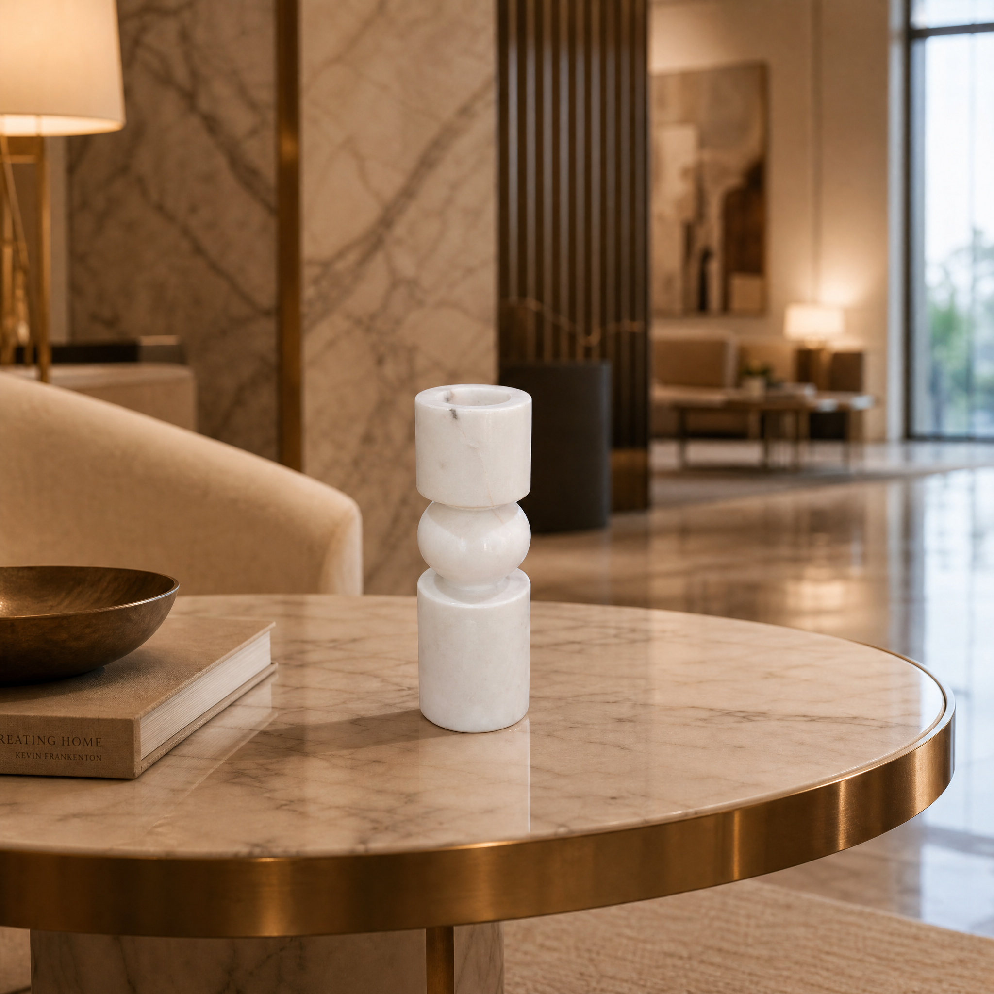A pair of VORELLI Fiamma small geometric marble candle holders creating a luxury ambiance on a boutique hotel reception console table.