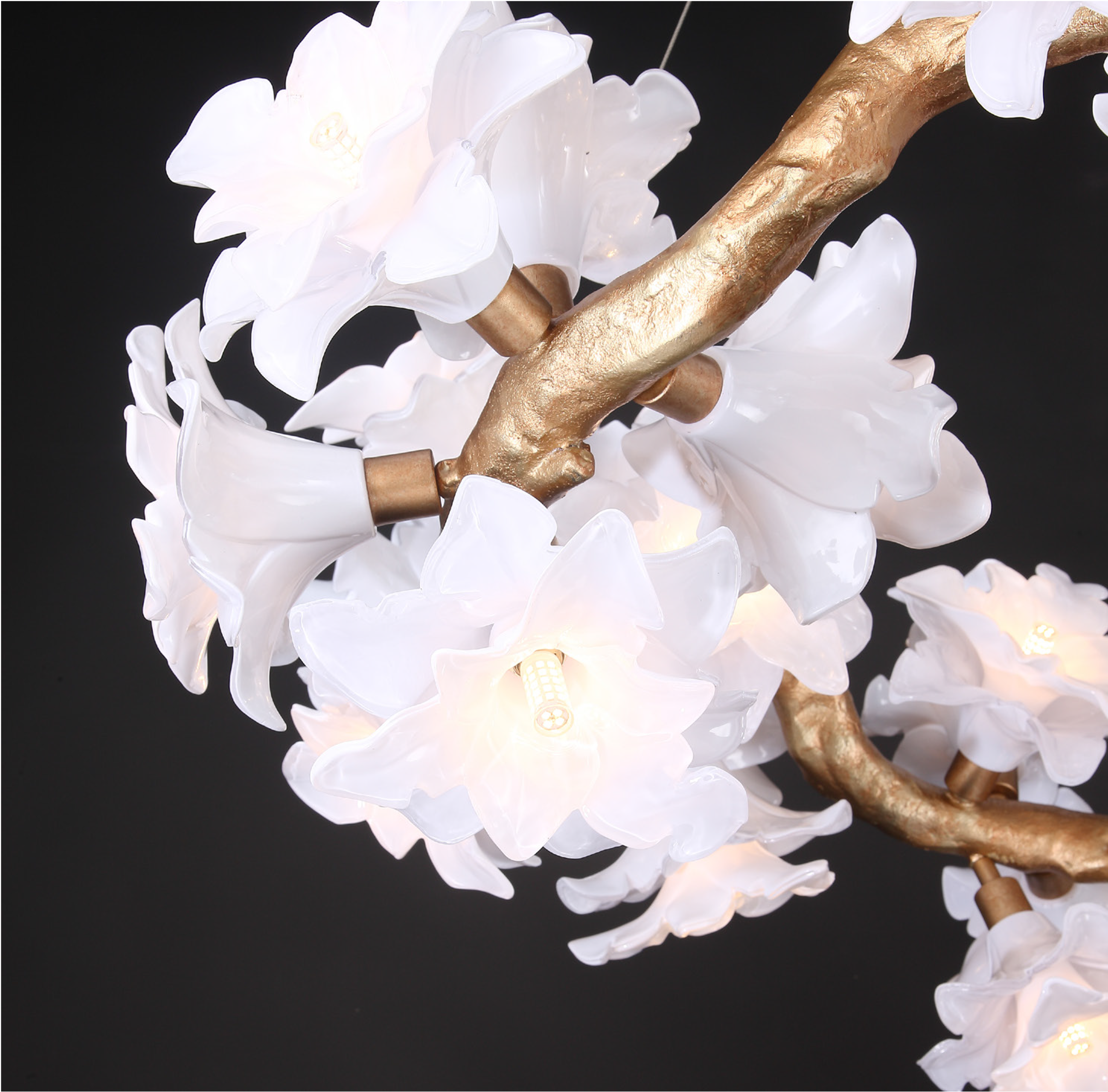 Gardenia Linear Staircase Chandelier by VORELLI® featuring sculptural floral glass detail