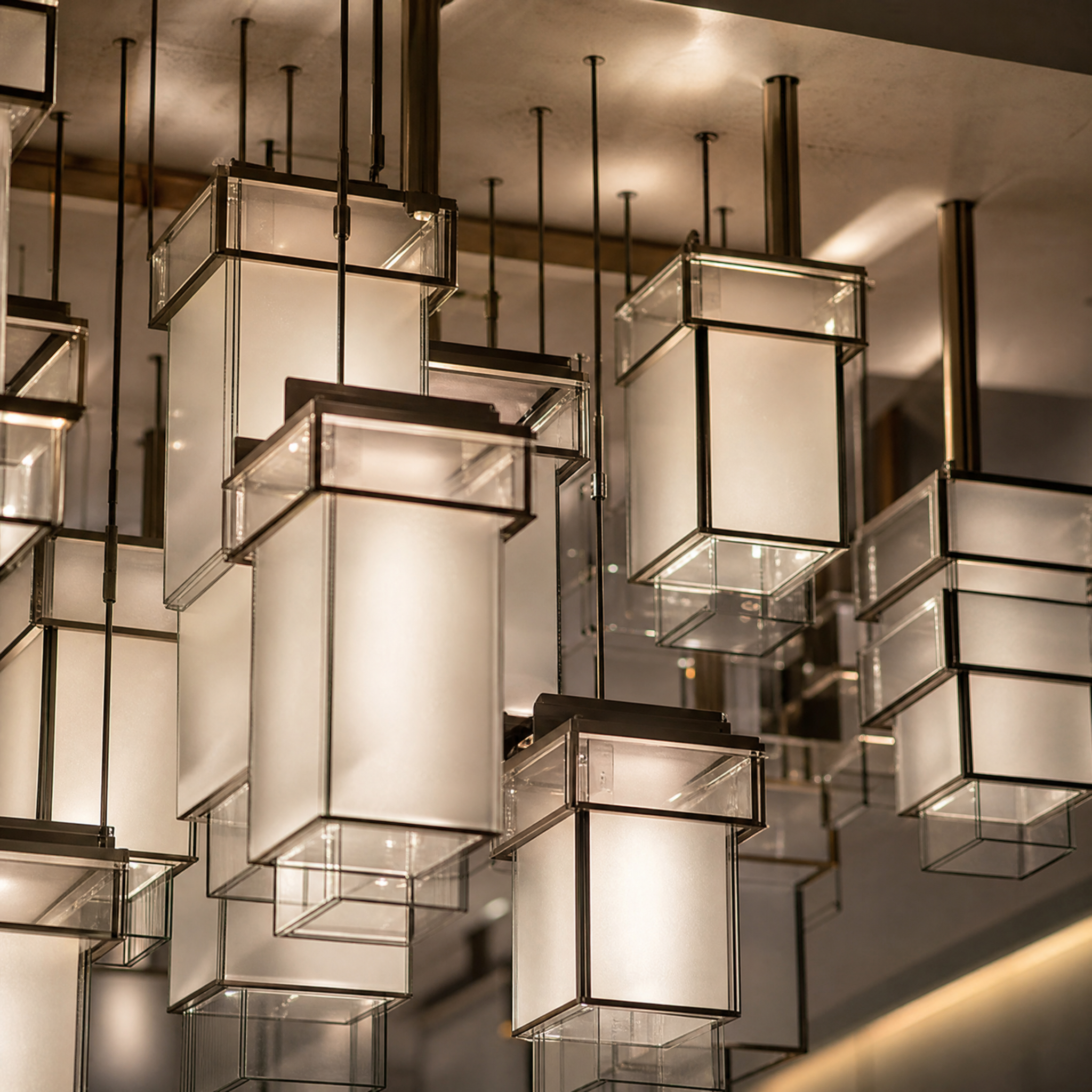 A detailed close-up shot of the VORELLI geometric acrylic installation, highlighting the balanced symmetry, clean lines, and soft light diffusion through the premium material.