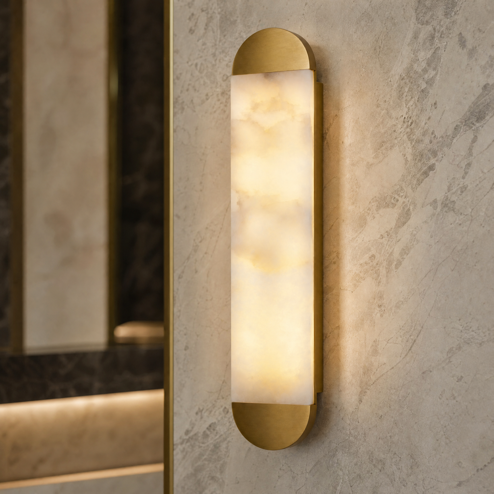 A detailed closeup of the VORELLI Lira wall light, showcasing the natural veining and sleek, rounded form of the premium marble material.