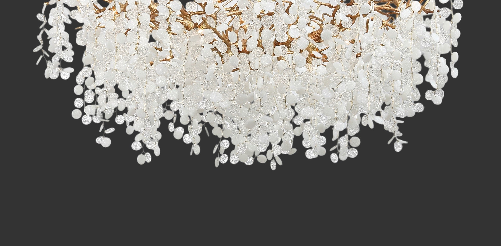 Close-up of Lunaria circular chandelier showing layered glass discs and organic form