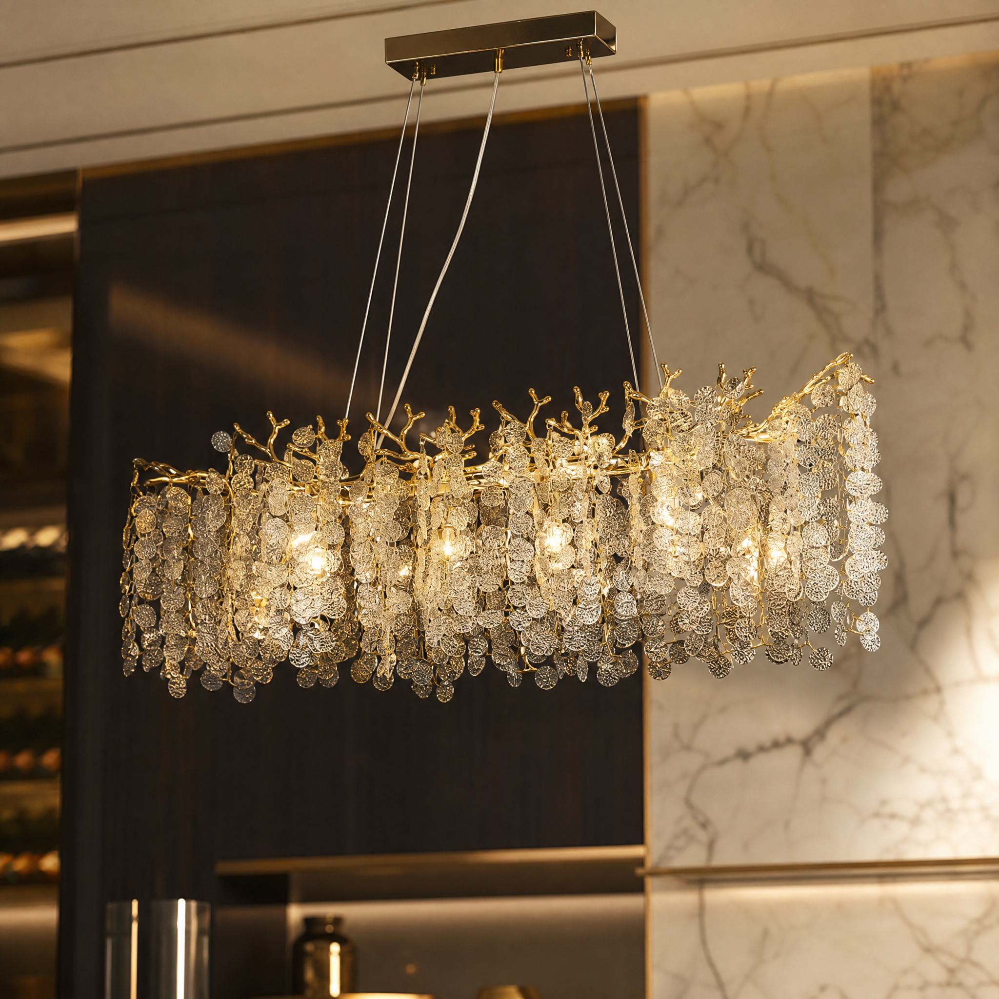A close-up view of the VORELLI Lunaria chandelier showcasing the detailed organic branch structure and the unique texture of the cascading glass discs.