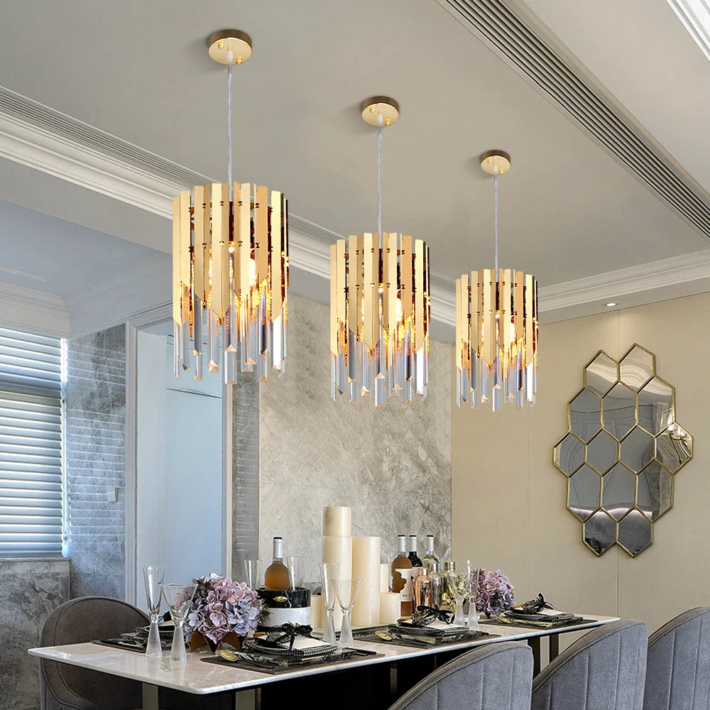 VORELLI Manhattan Pendant with sleek crystal bars illuminating a luxury dining room setting