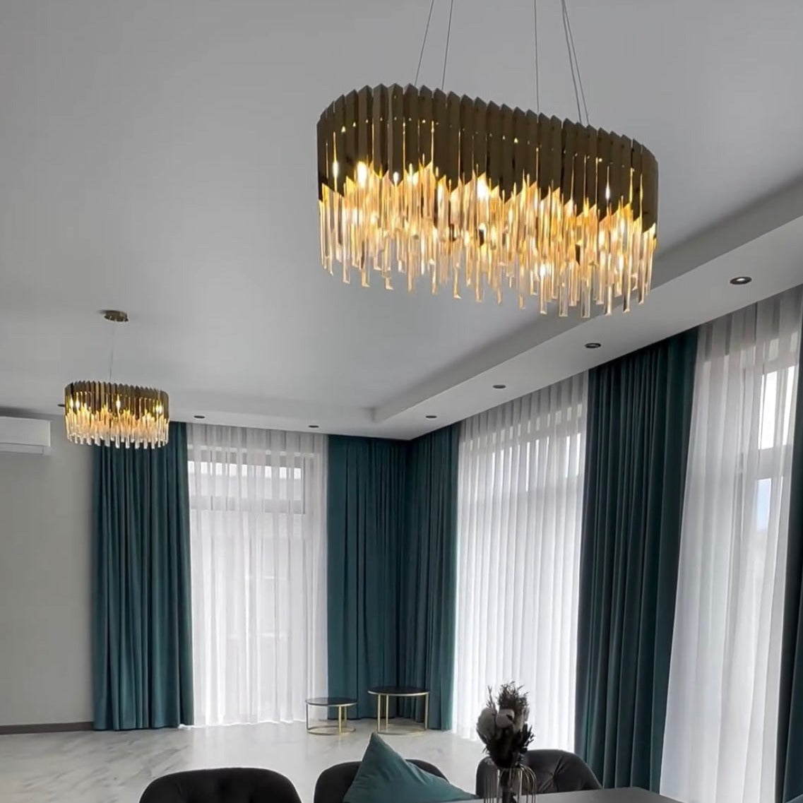 Contemporary interior illuminated by the VORELLI Manhattan Rectangular Chandelier with layered crystal detailing