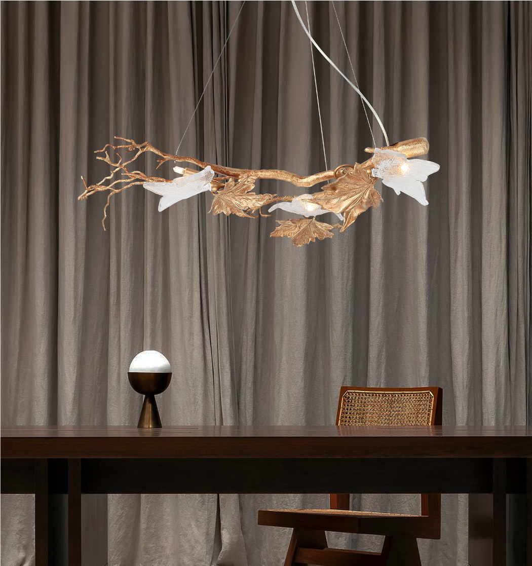 Luxury rectangular chandelier with leaf detailing above dining table