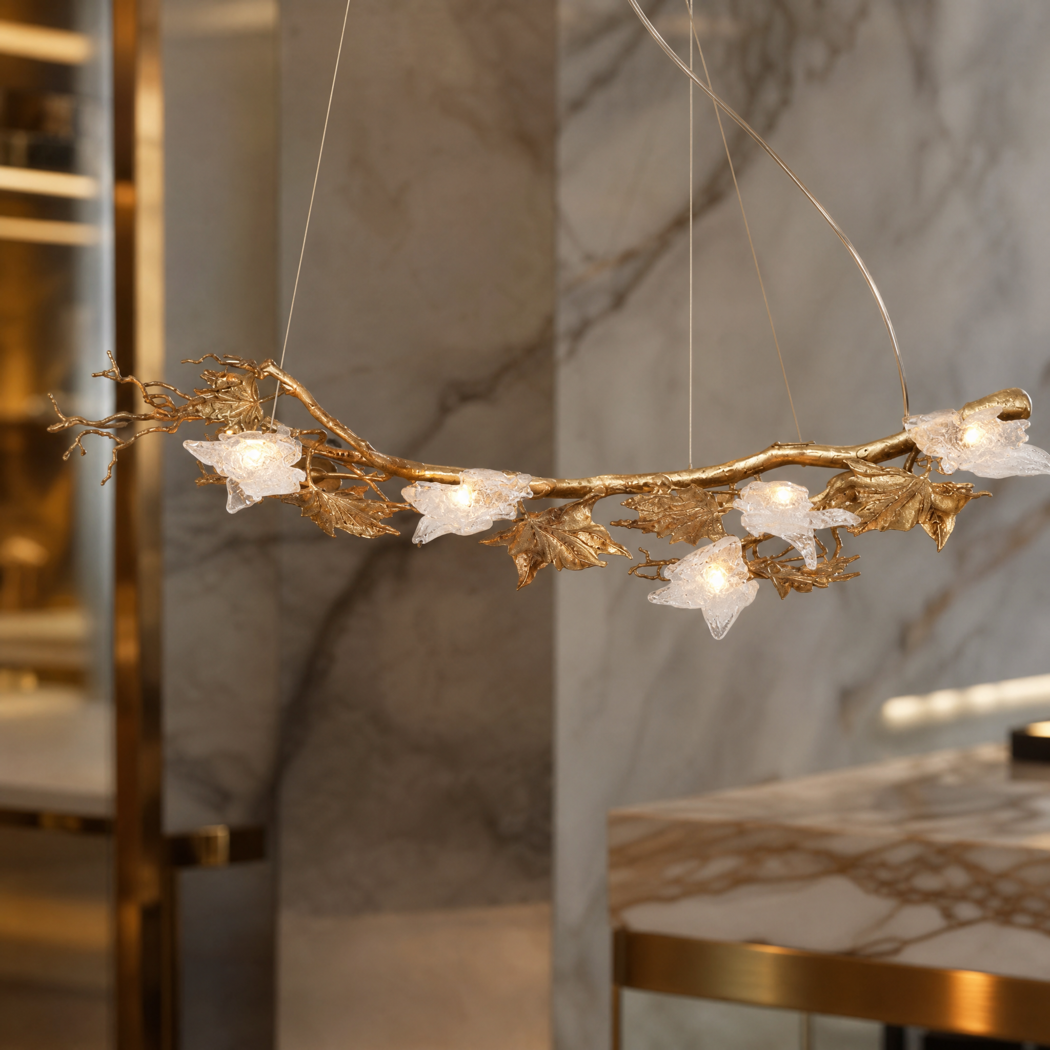 Close-up view of the intricate sculptural branches and delicate glass leaf forms on the VORELLI Maple Grove chandelier.