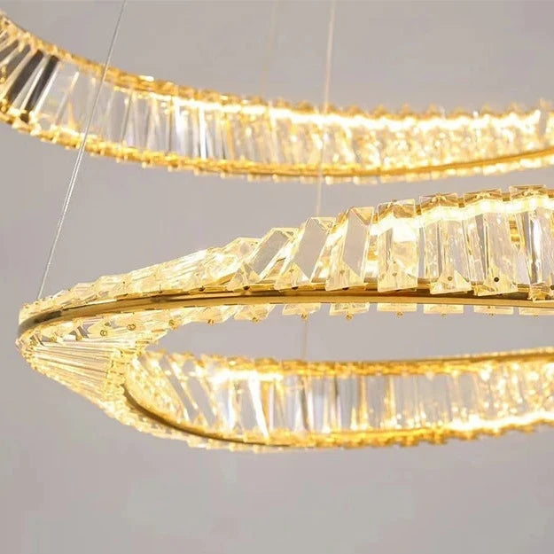 Detailed close-up of twisted crystal bars forming the dual circular structure of the VORELLI Melia chandelier