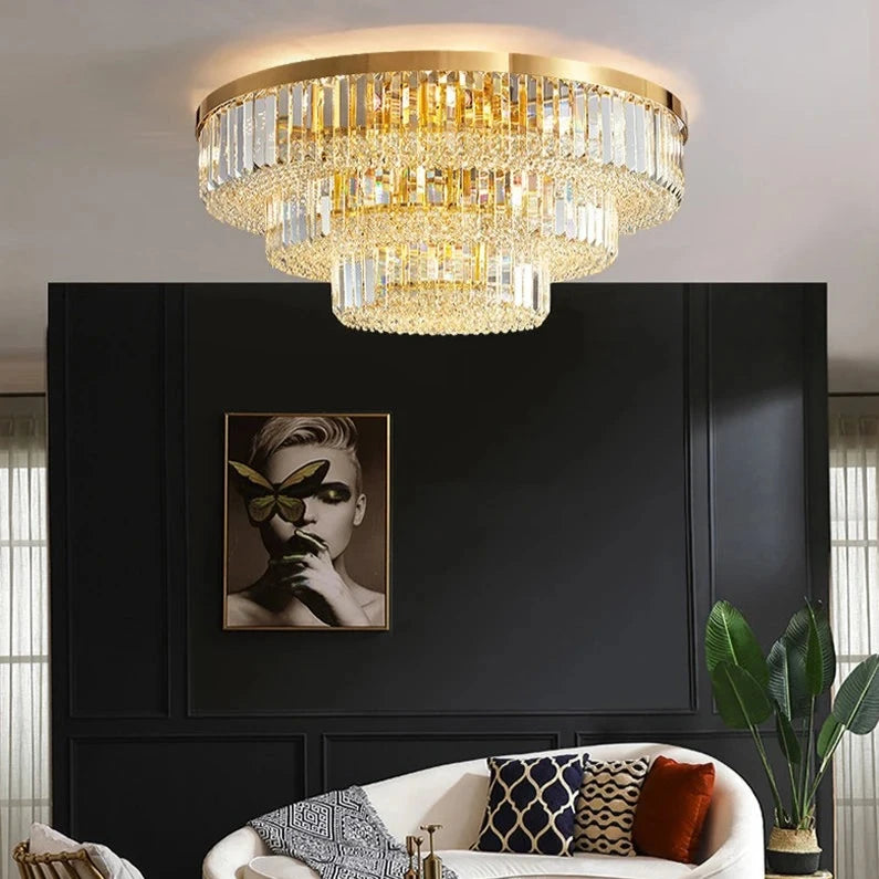 VORELLI Merlimont ceiling light with tiered crystal bars and gold frame illuminating a luxury living room