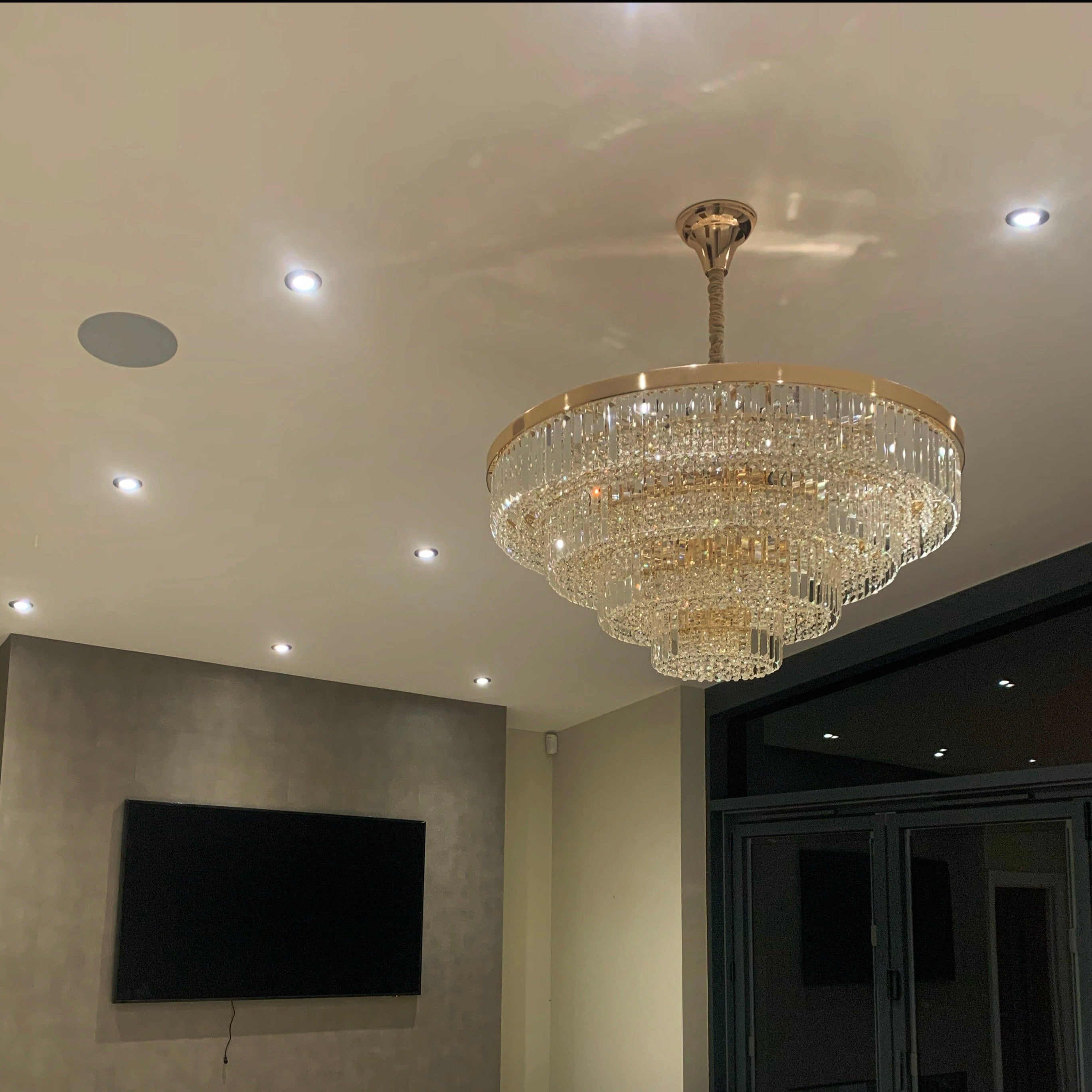 VORELLI Merlimont circular crystal chandelier installed in a refined contemporary interior