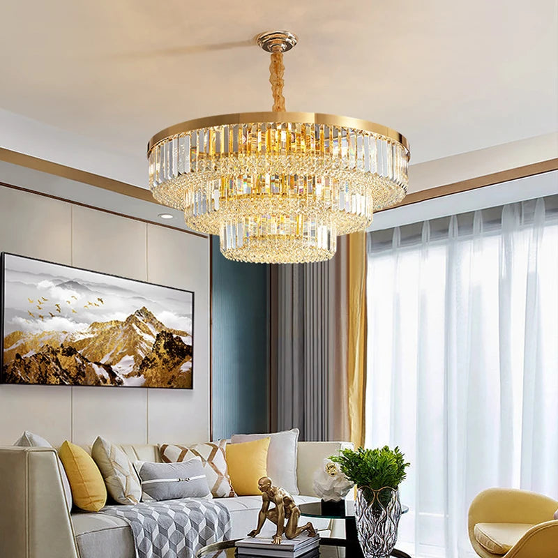 VORELLI Merlimont circular chandelier with tiered crystal bars and gold frame illuminating a luxury living room