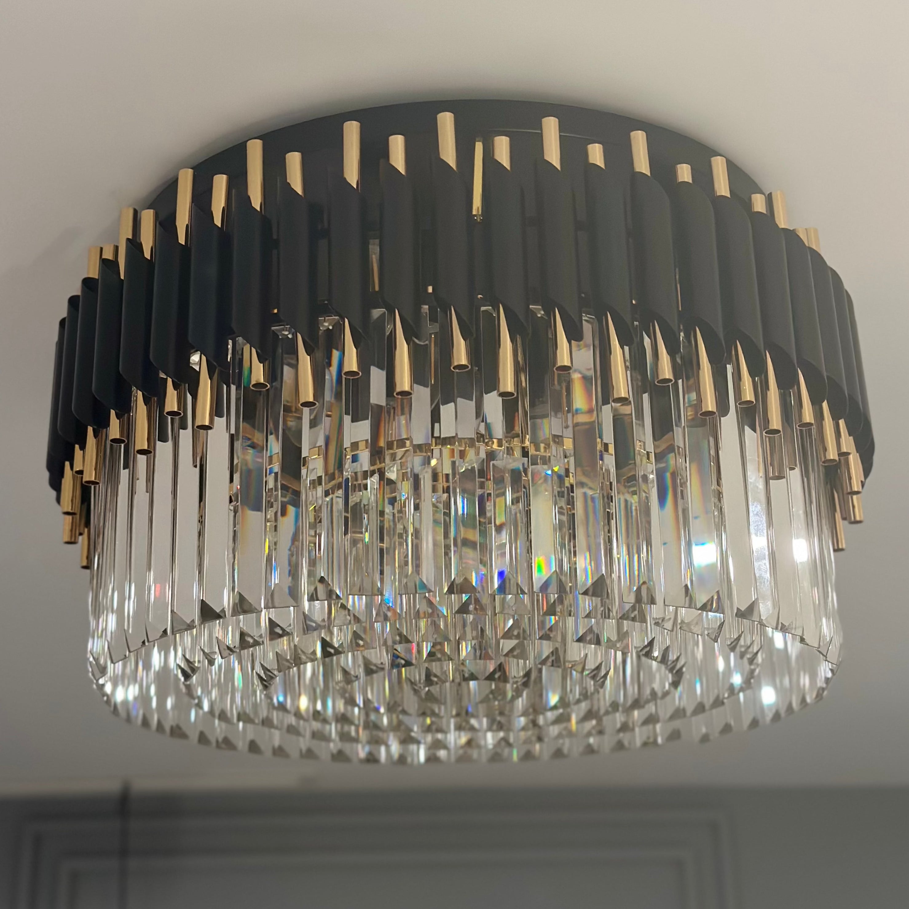 VORELLI Milltimber crystal ceiling light featuring circular tiers of faceted crystal bars and sleek cylinder tubing