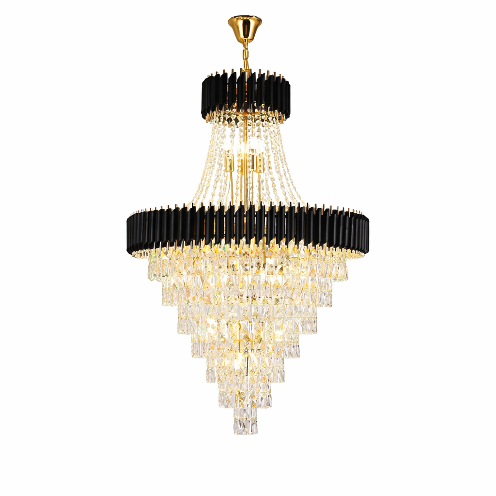 VORELLI Milltimber Grandeur crystal chandelier in a double-height staircase void, highlighting the bold contrast of black architectural fins and sparkling crystals.