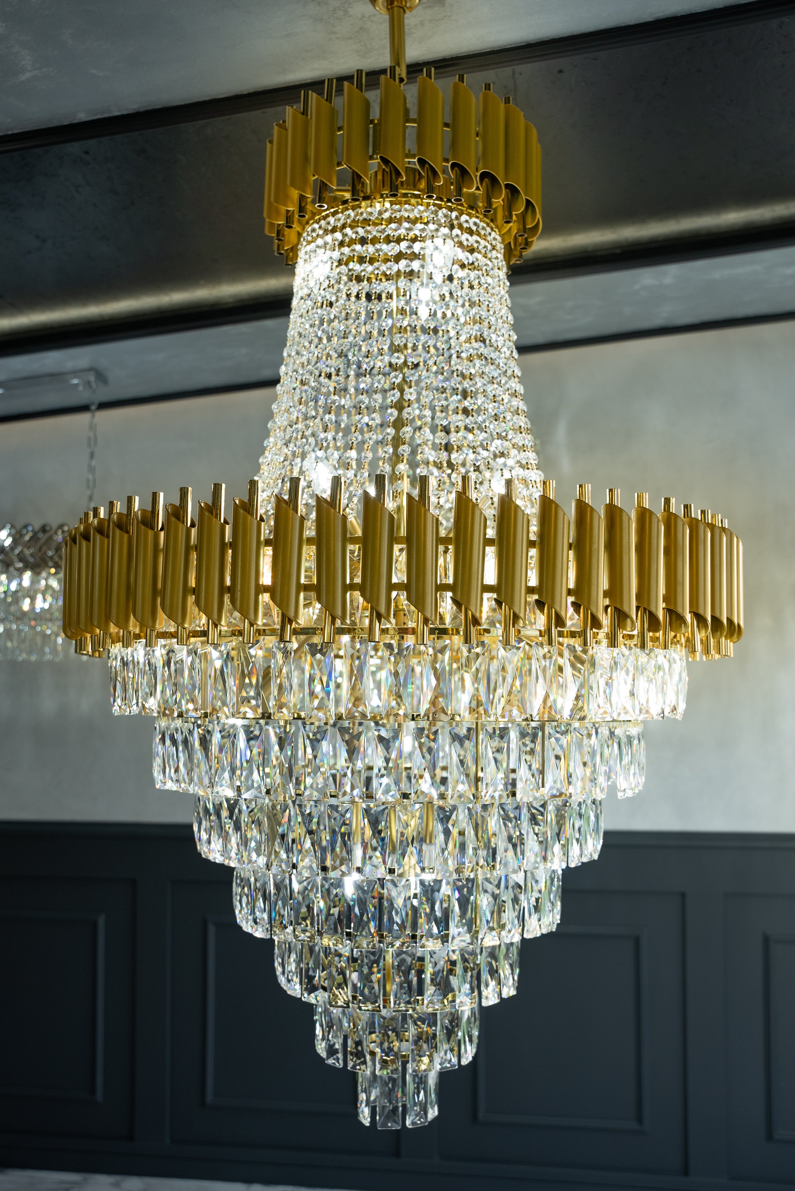 VORELLI Milltimber Grandeur staircase chandelier with layered diamond-cut crystal drops and bold architectural frame