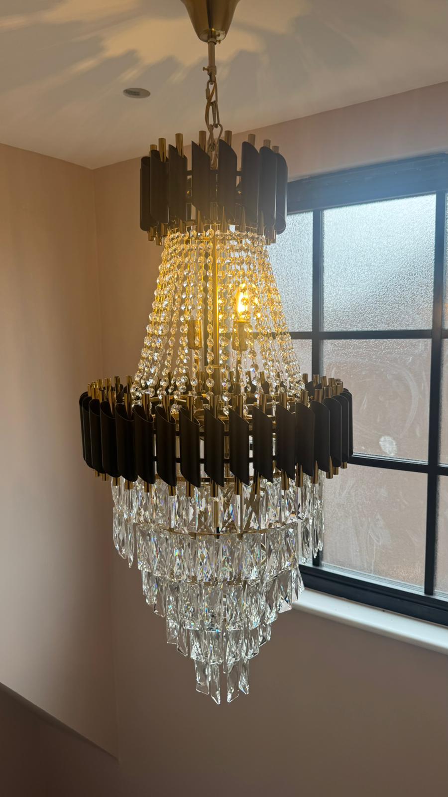 VORELLI Milltimber Grandeur staircase chandelier installed in a luxury double-height stairwell