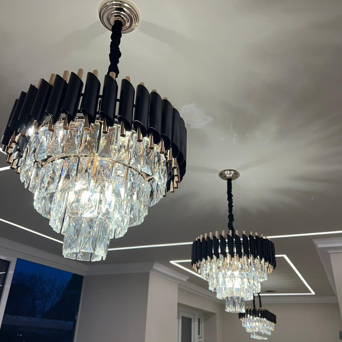 VORELLI Milltimber Pendant Light suspended from a ceiling in a modern living space with radiant crystal layers