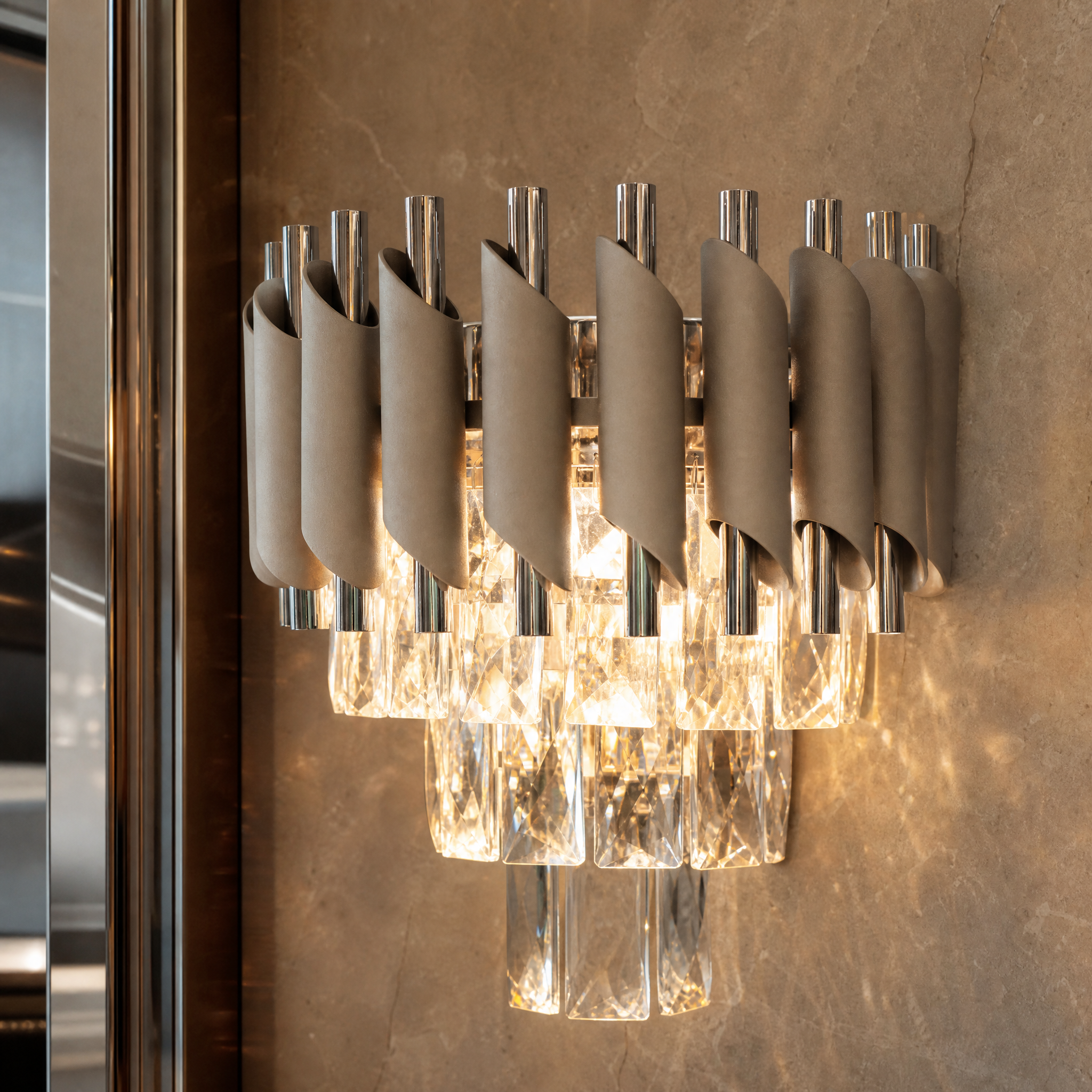 A detailed closeup of the VORELLI Milltimber Wall Light, highlighting the premium sleek cylinder tubing and the striking, light-refracting rectangle crystals.