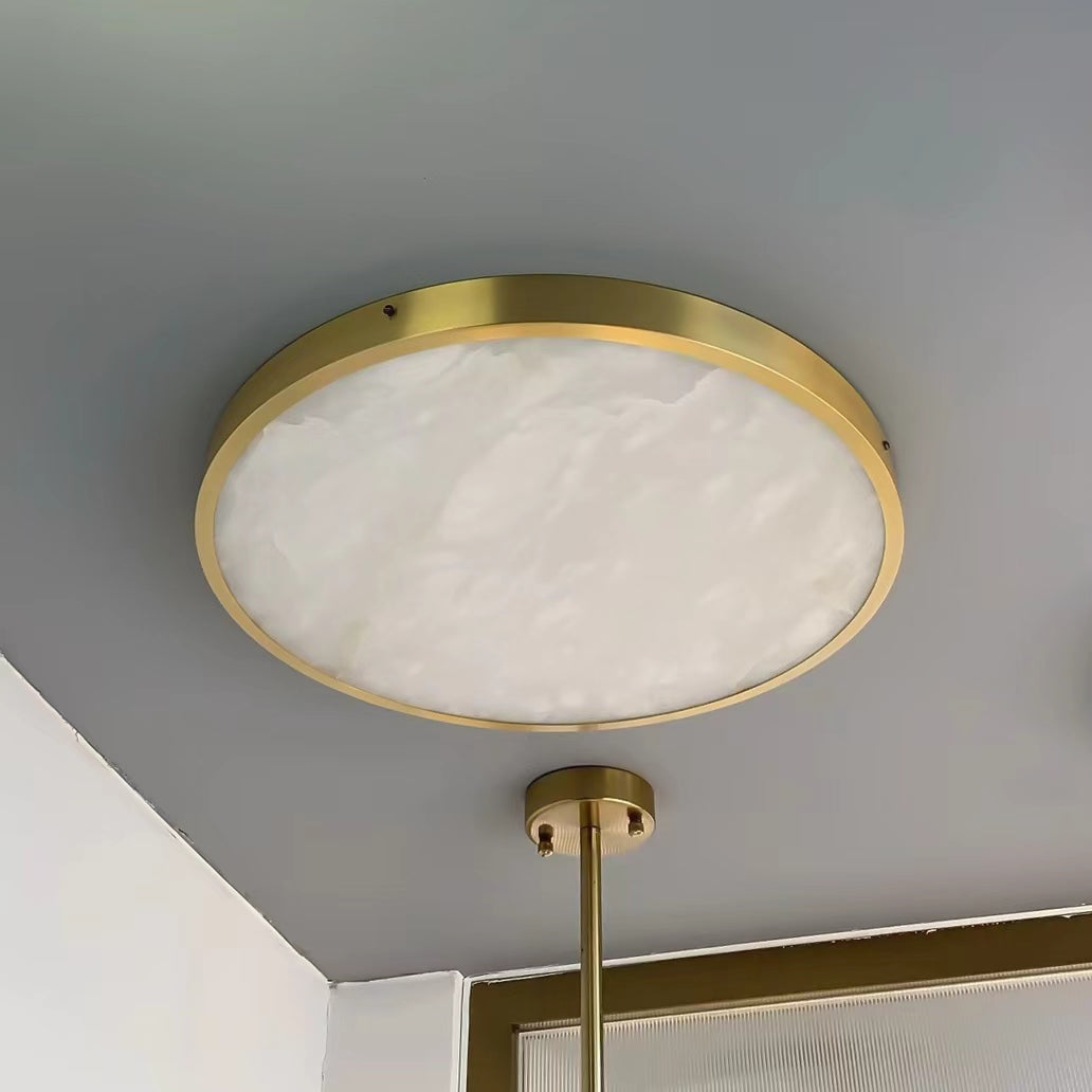 VORELLI® Morenita alabaster circular ceiling light installed in contemporary interior adding warm ambient lighting