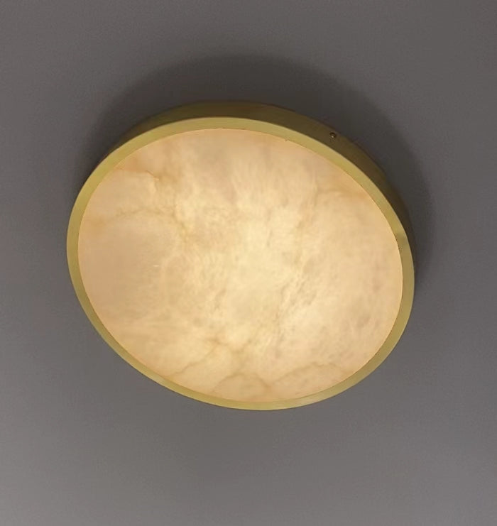 Close up of illuminated marble diffuser on VORELLI® Morenita circular ceiling light highlighting natural stone texture