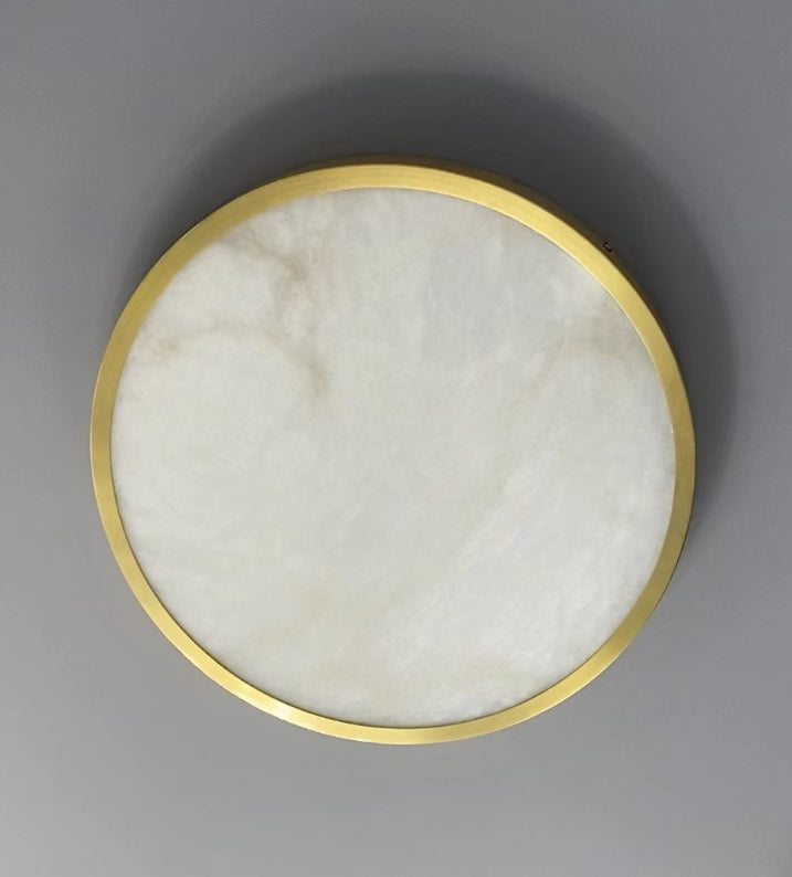 VORELLI® Morenita marble ceiling light mounted to ceiling with smooth circular stone surface creating soft illumination