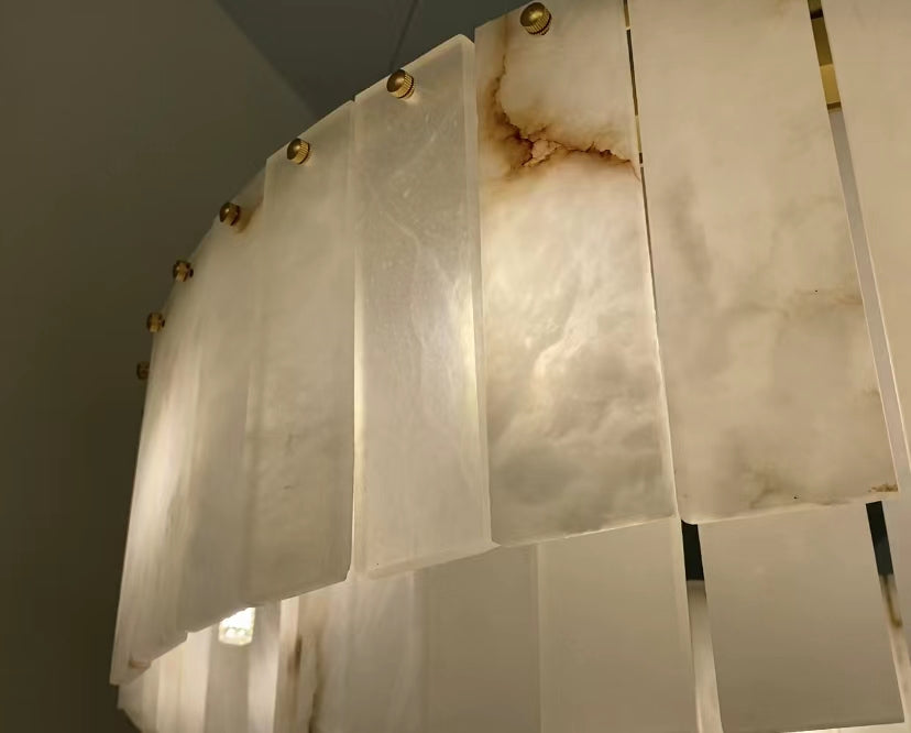 Close up of hand cut marble panels on VORELLI® Munro circular chandelier showcasing natural stone texture