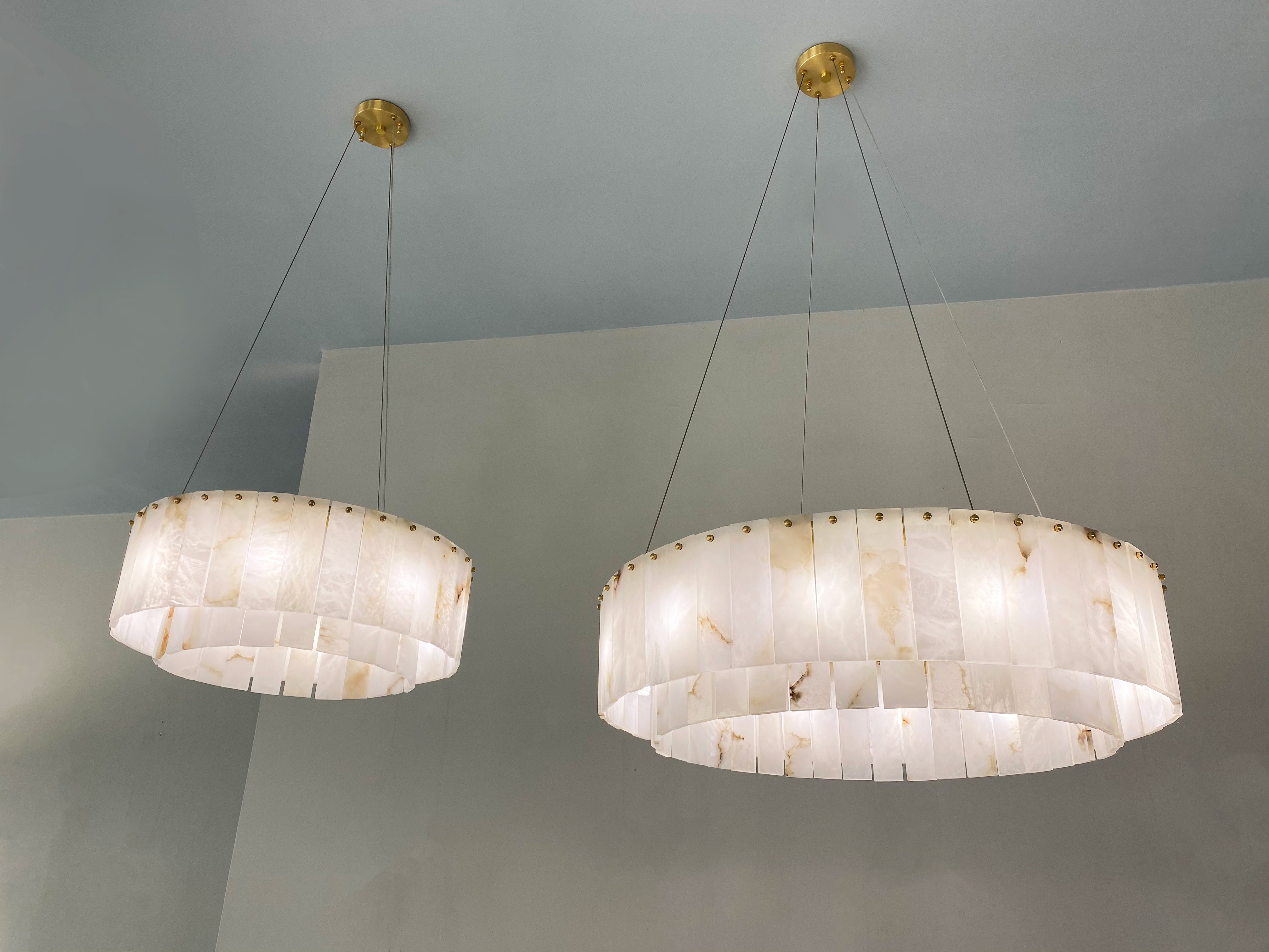 VORELLI® Munro luxury marble chandelier installed in refined modern interior with circular stone composition