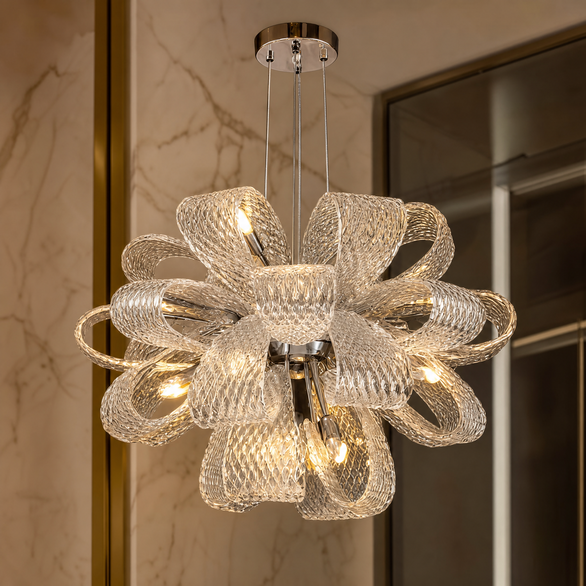 Detailed closeup of the VORELLI Munz chandelier highlighting the elegant textured glass ribbons and contemporary circular frame.