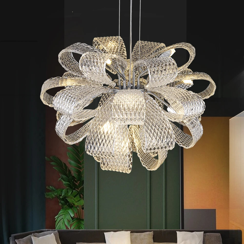 VORELLI® Munz designer glass chandelier suspended above dining table with sculptural ribbon form