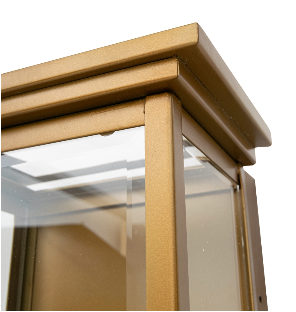 Close up of VORELLI® Novara wall light highlighting clear glass panels and structured frame composition