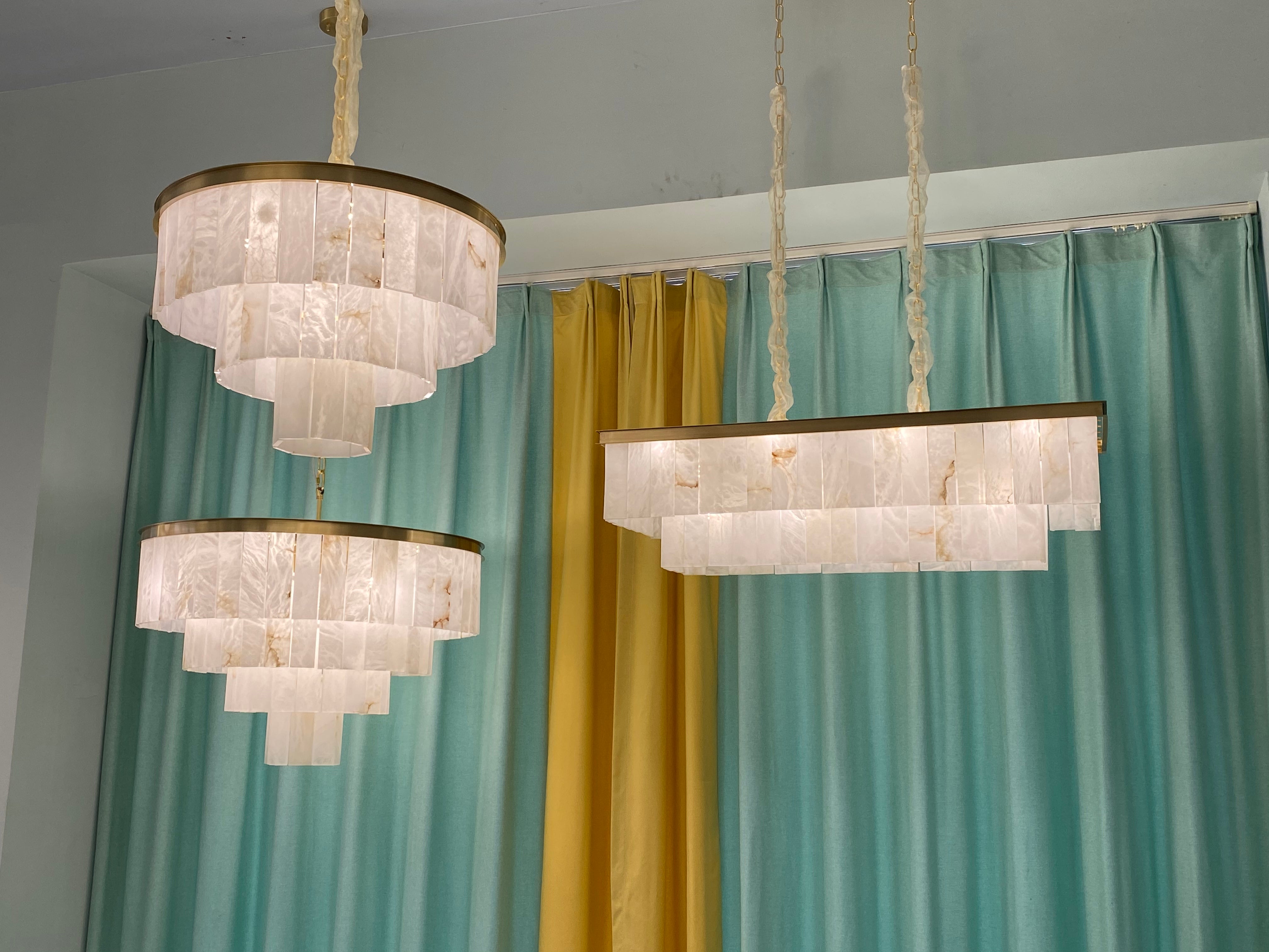 VORELLI® Novella luxury marble rectangular chandelier enhancing grand interior with geometric tiered stone design
