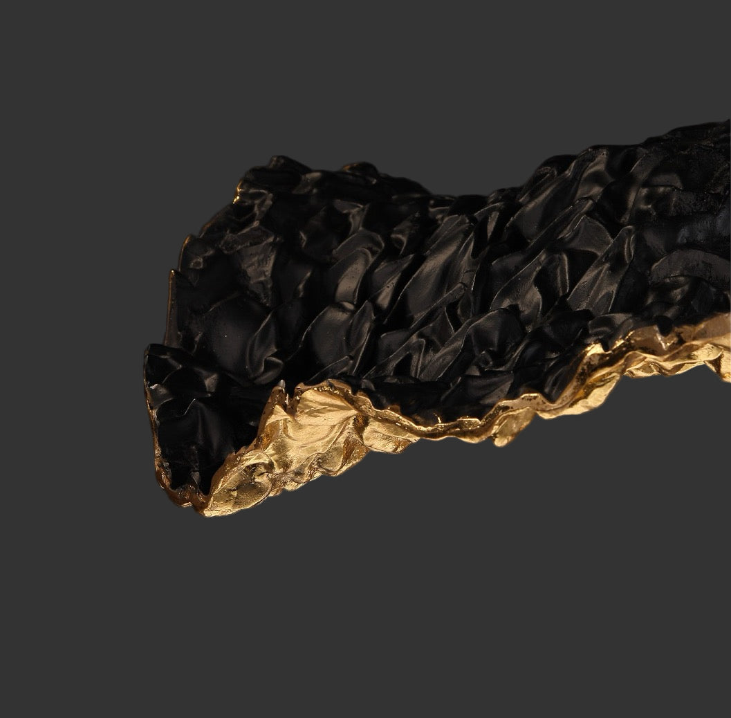 Detailed view of Obscura pendant light sculptural gold surface by VORELLI